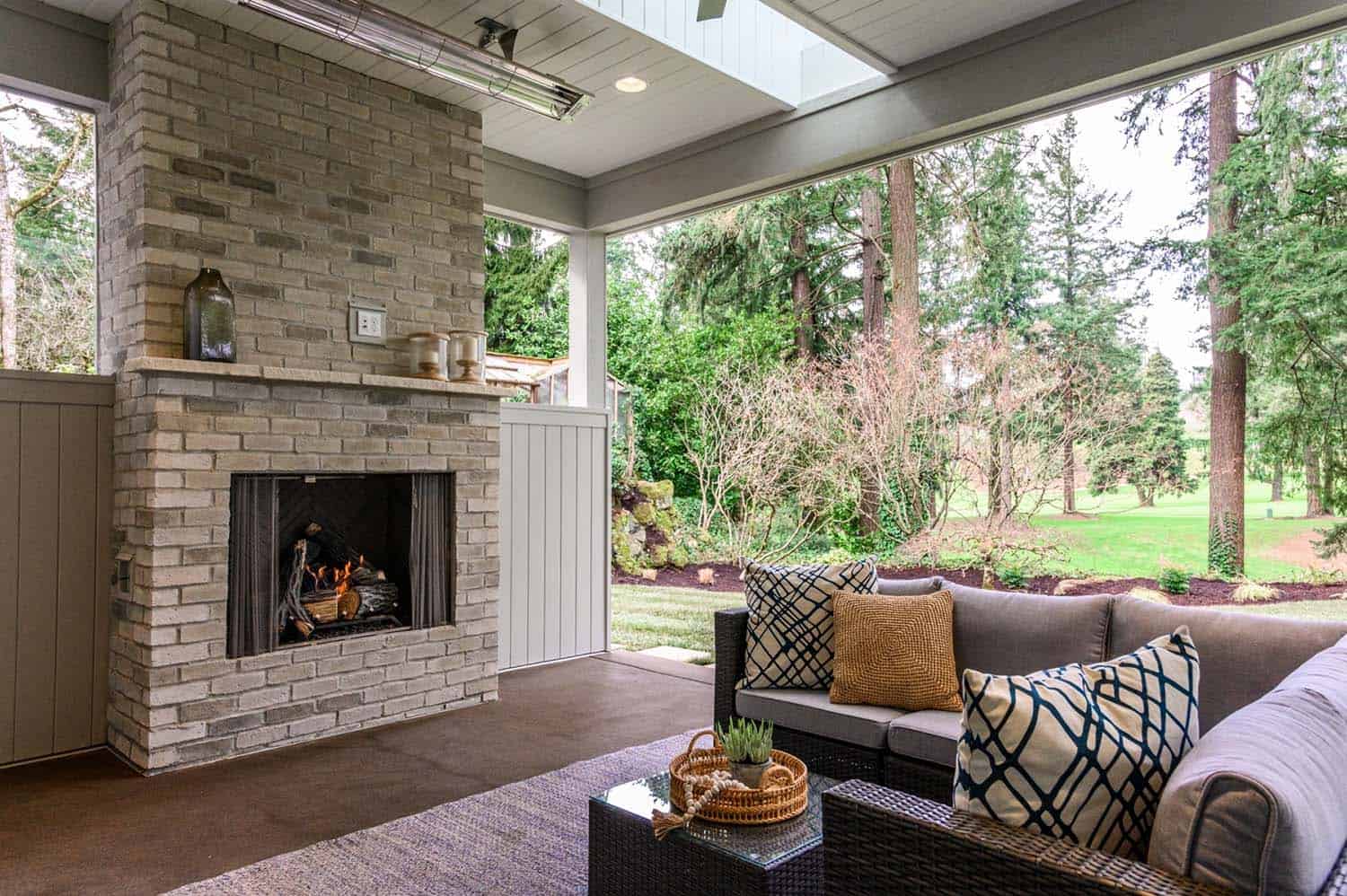 transitional-covered-porch-with-a-fireplace
