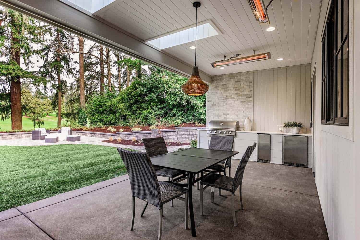 transitional-covered-porch-with-dining-area-and-outdoor-kitchen