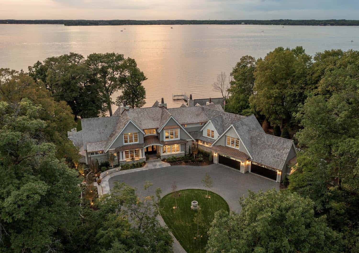 coastal-style-lake-house-exterior-aerial-view-at-dusk