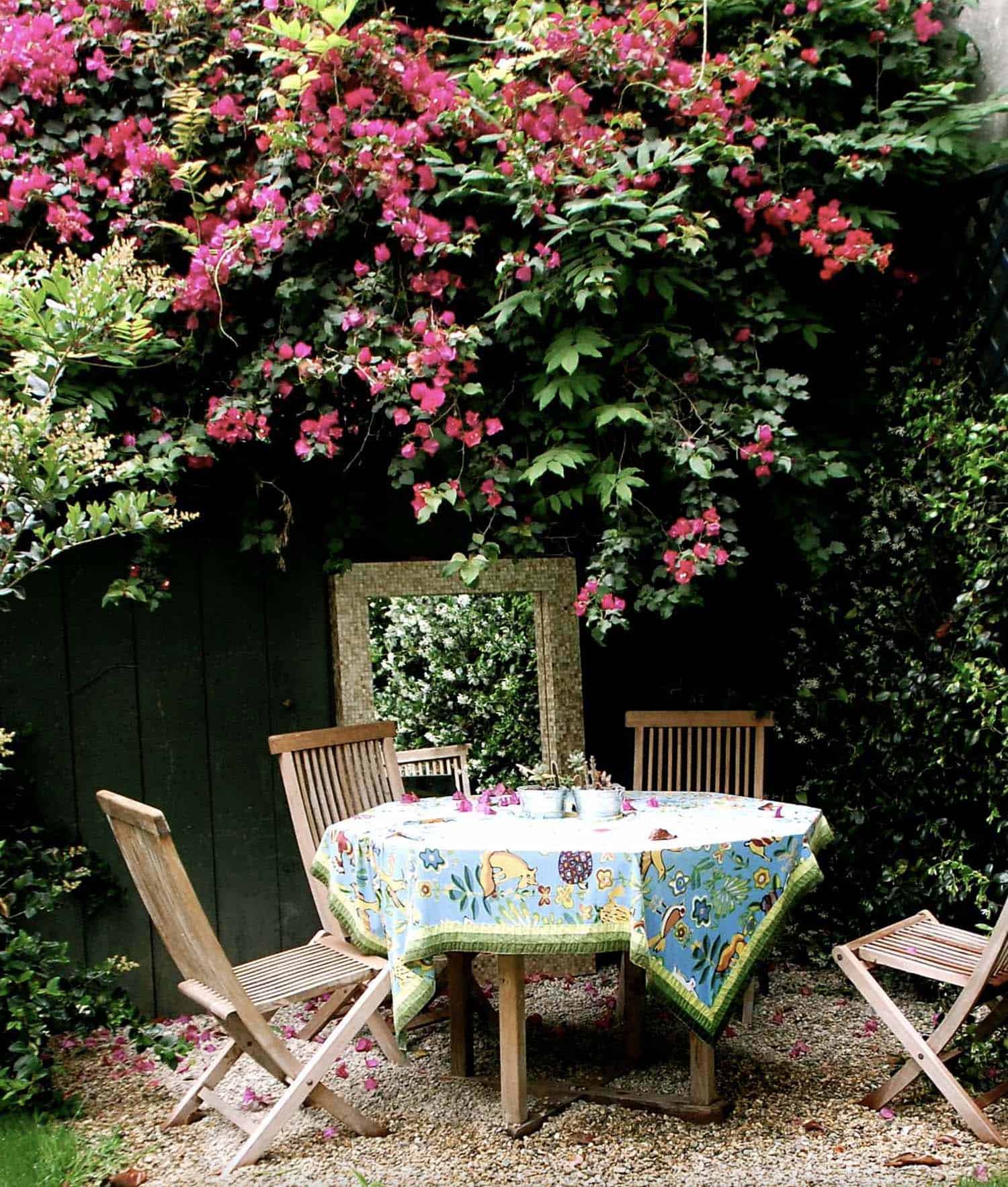secret-garden-nook-with-outdoor-dining-and-flowers