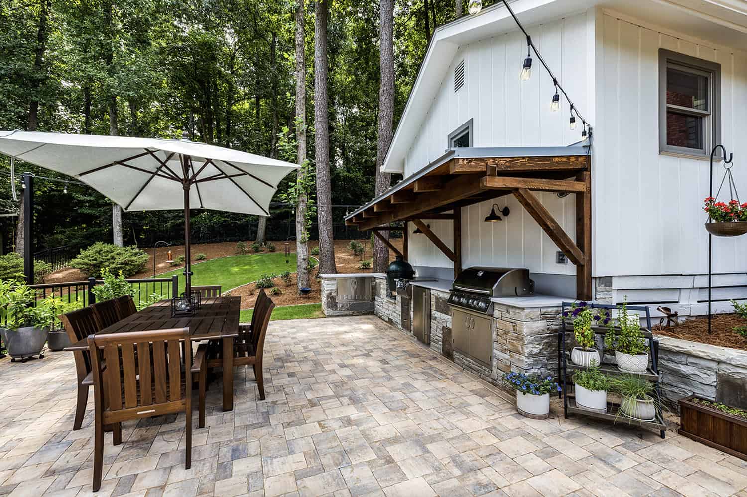 outdoor-dream-kitchen-with-a-custom-cantilevered-timber-pergola-and-grey-metal-roof-and-alfresco-dining