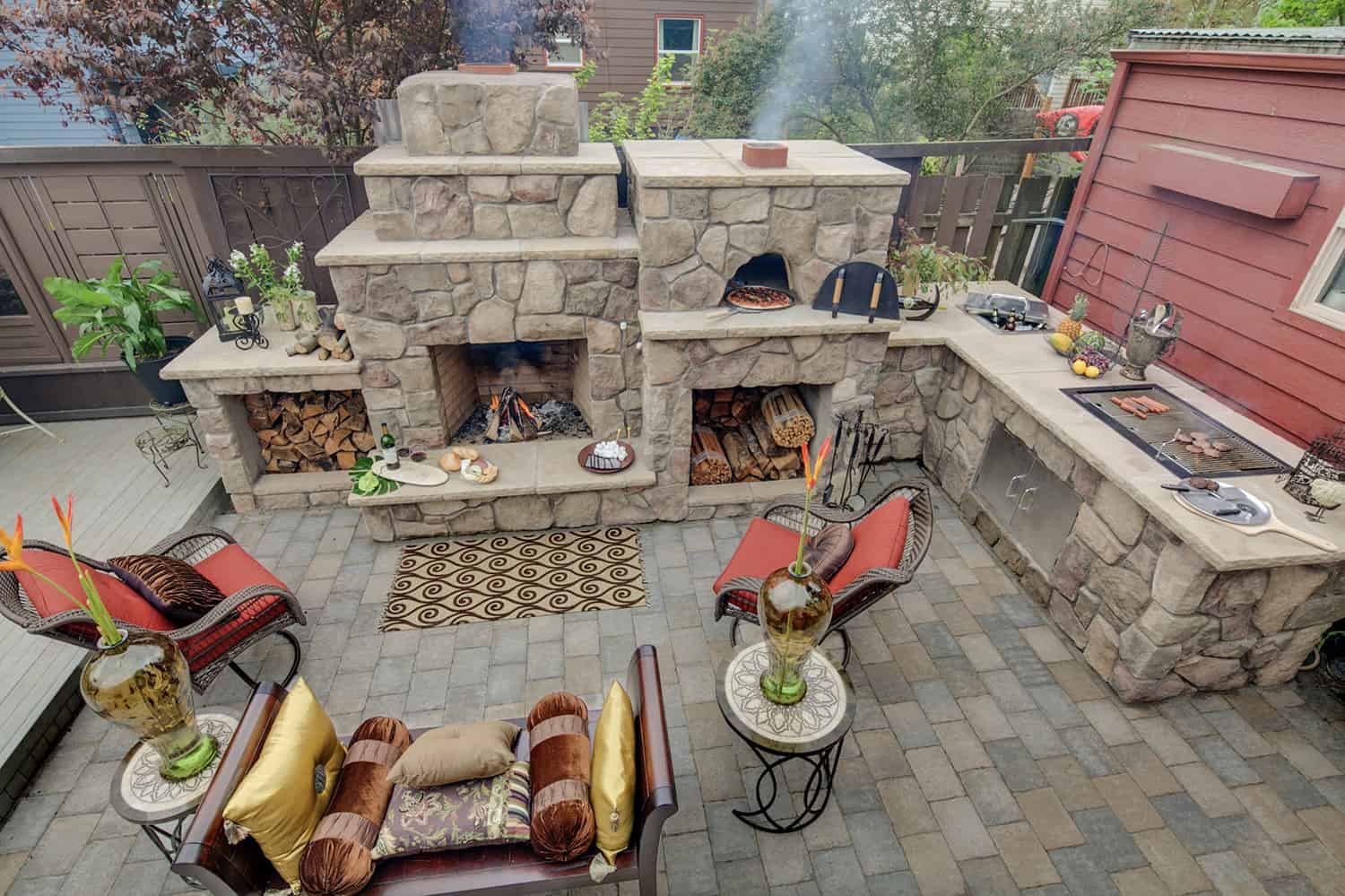 mediterranean-style-patio-with-a-fireplace-grill-and-pizza-oven
