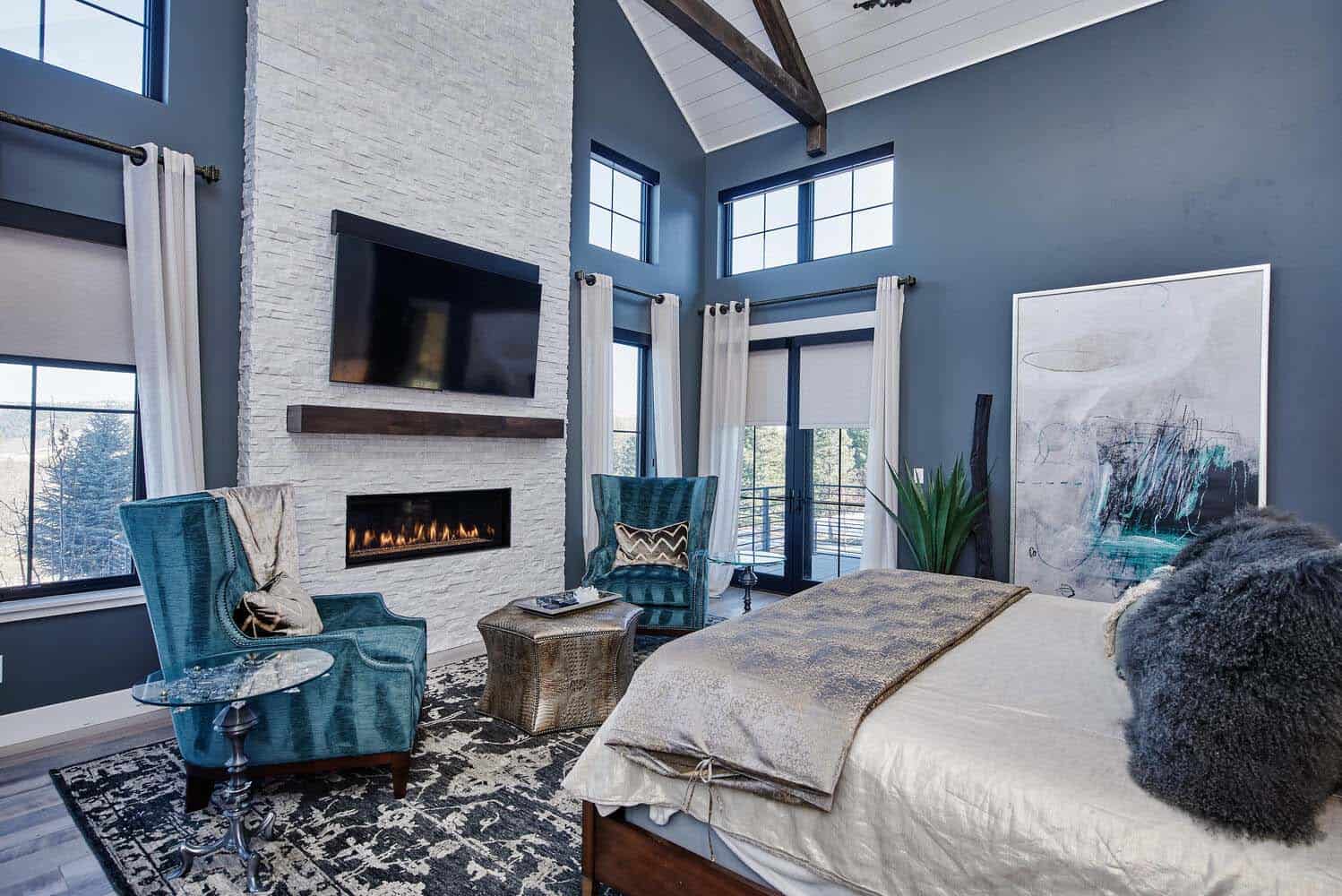 modern-glam-farmhouse-bedroom-with-a-fireplace