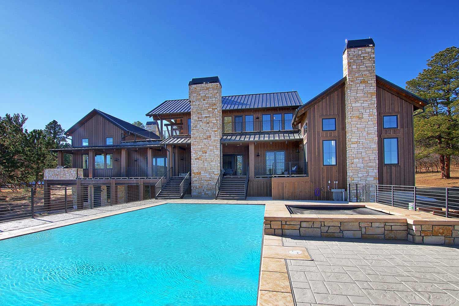 modern-glam-farmhouse-exterior-with-a-pool