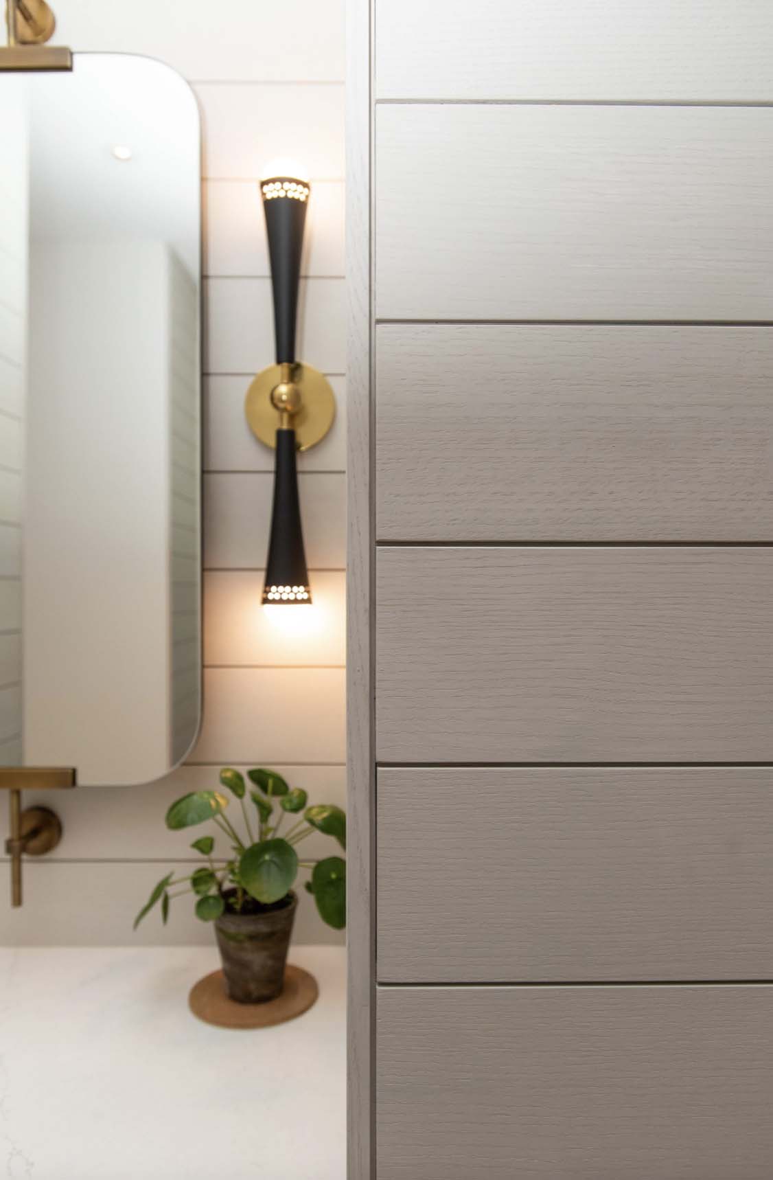 modern-bathroom-with-a-wall-sconce-detail