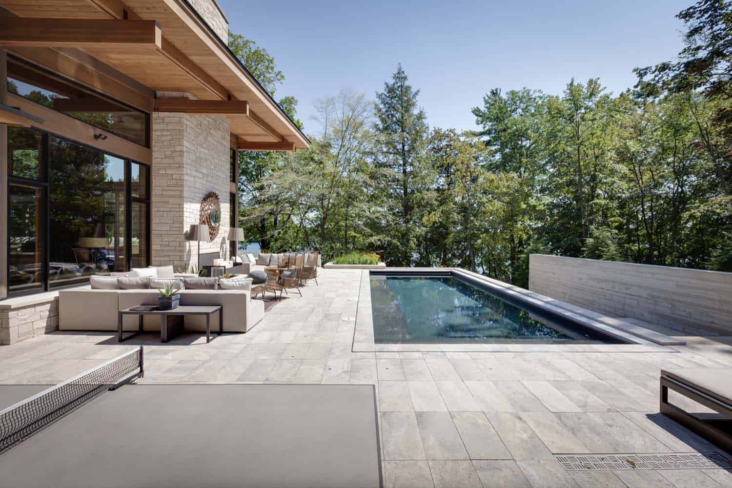 lakeside-resort-home-modern-exterior-pool-and-patio