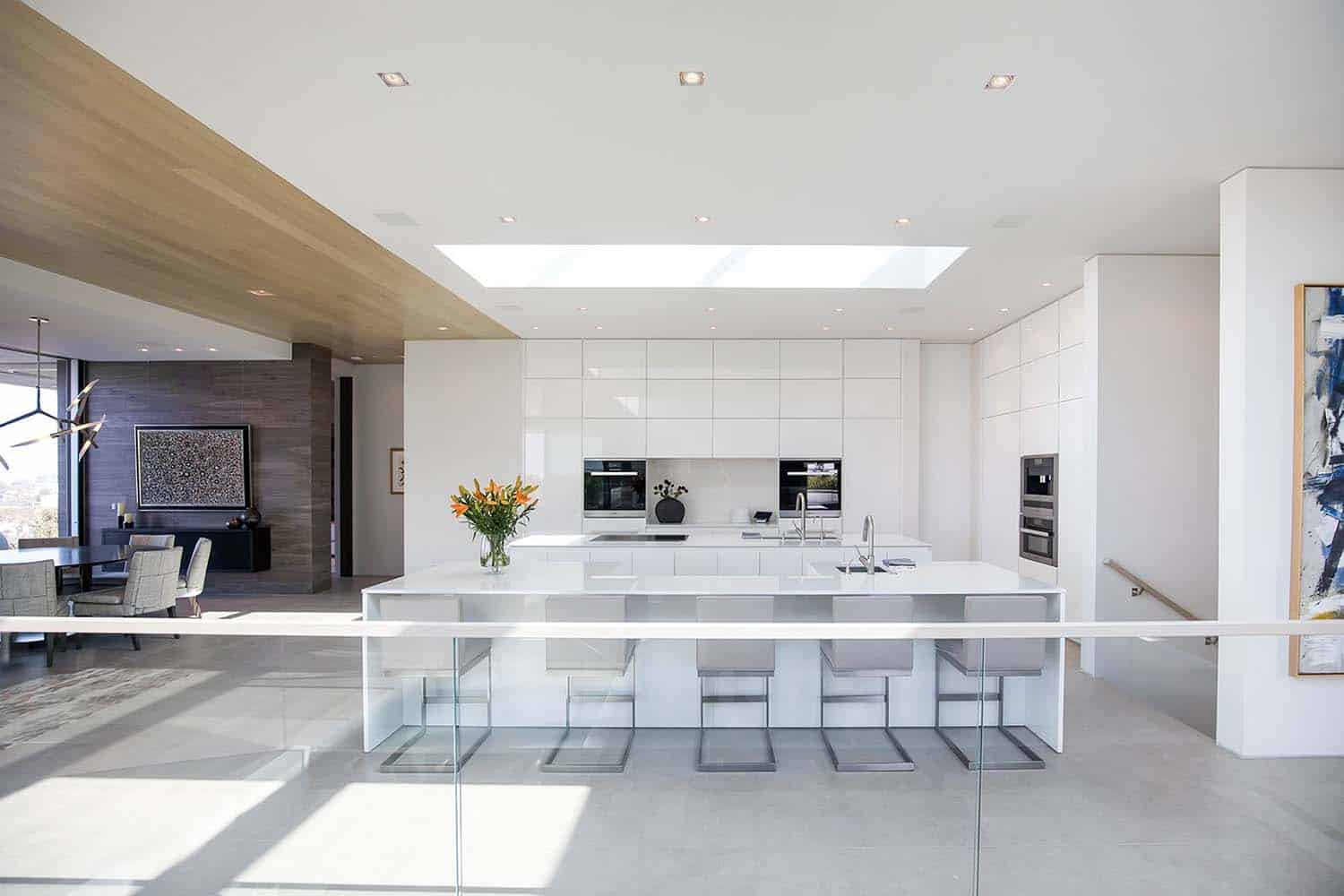 modern-kitchen-with-white-laminated-cabinets-and-skylight