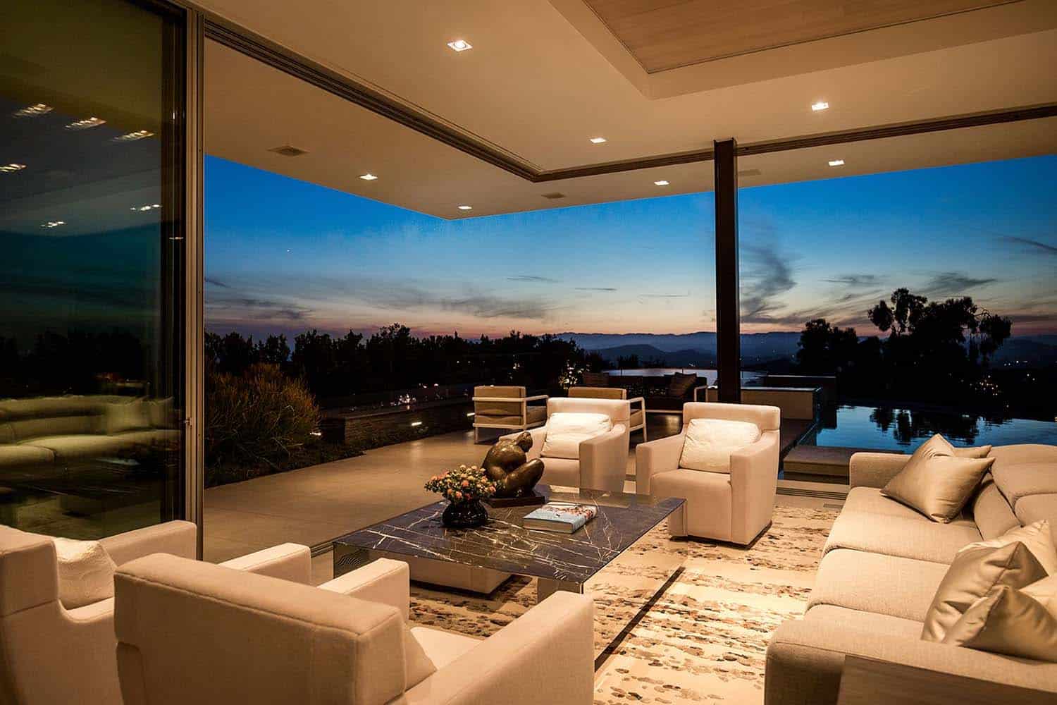 modern-living-room-with-sliding-glass-doors-at-dusk