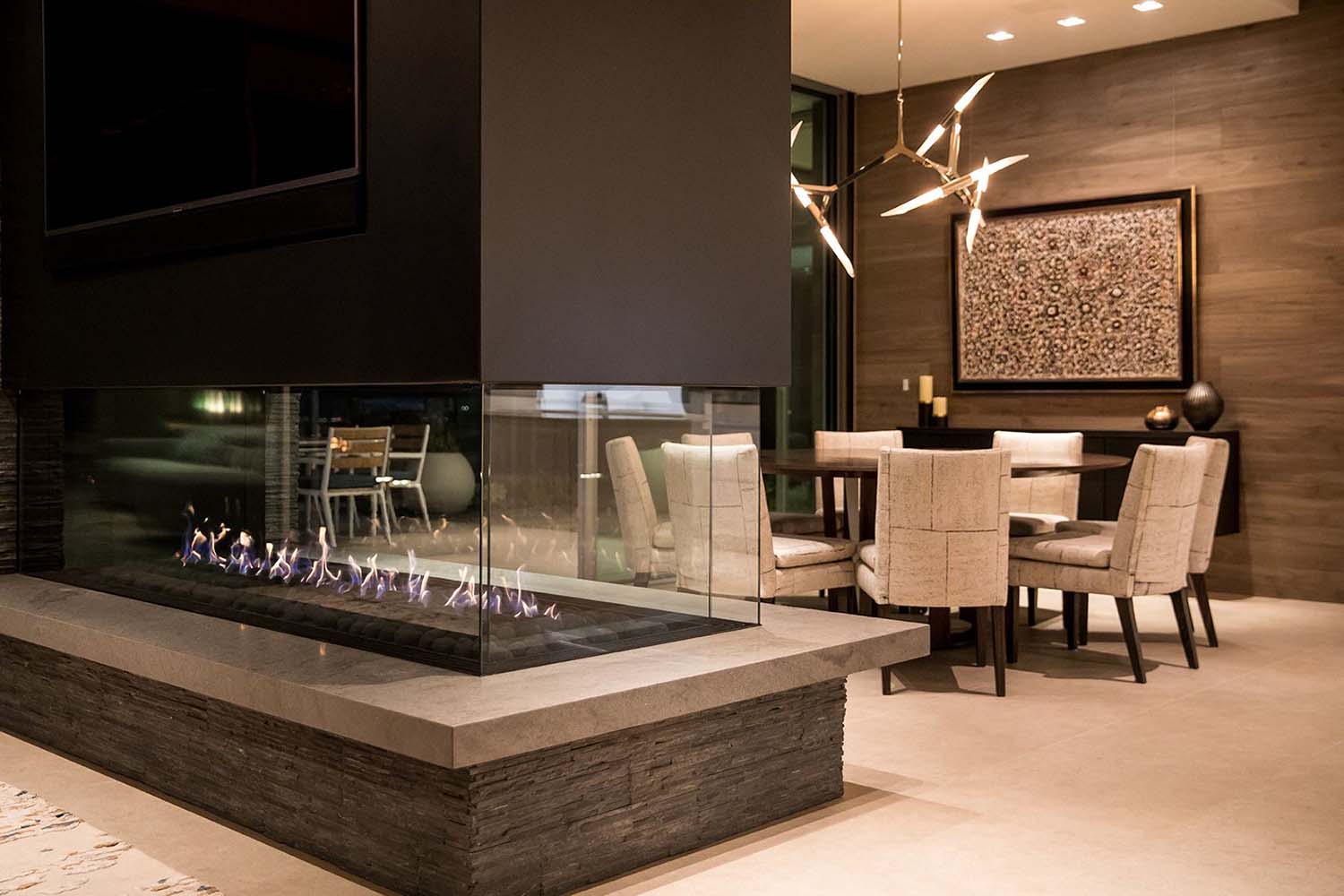 modern-dual-sided-fireplace-with-dining-room-view