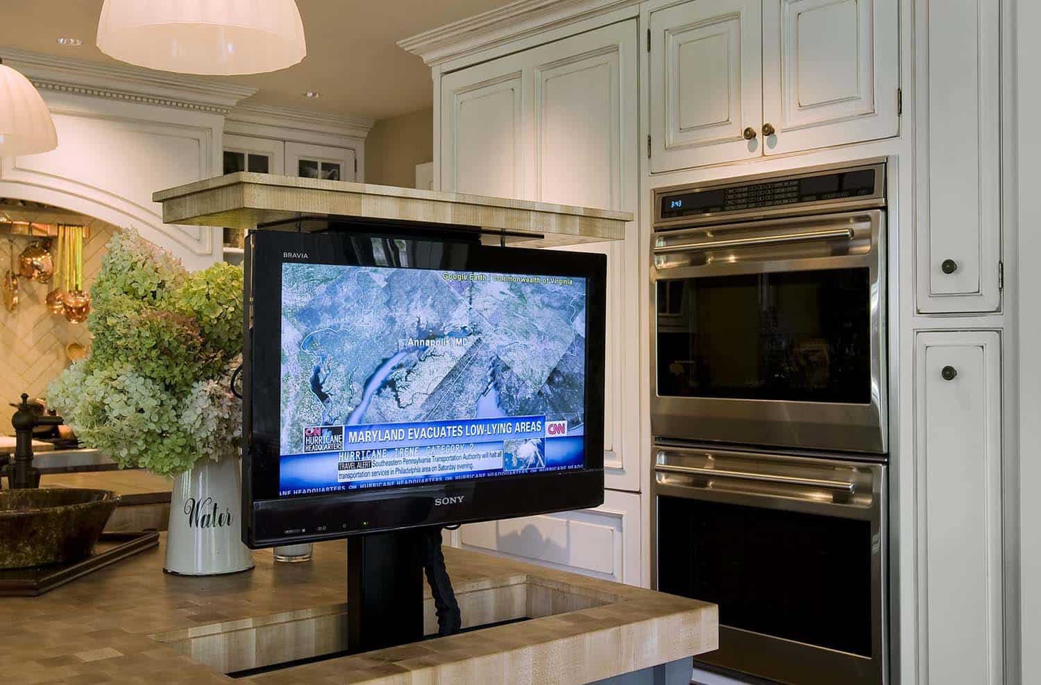 traditional kitchen with a pop up tv