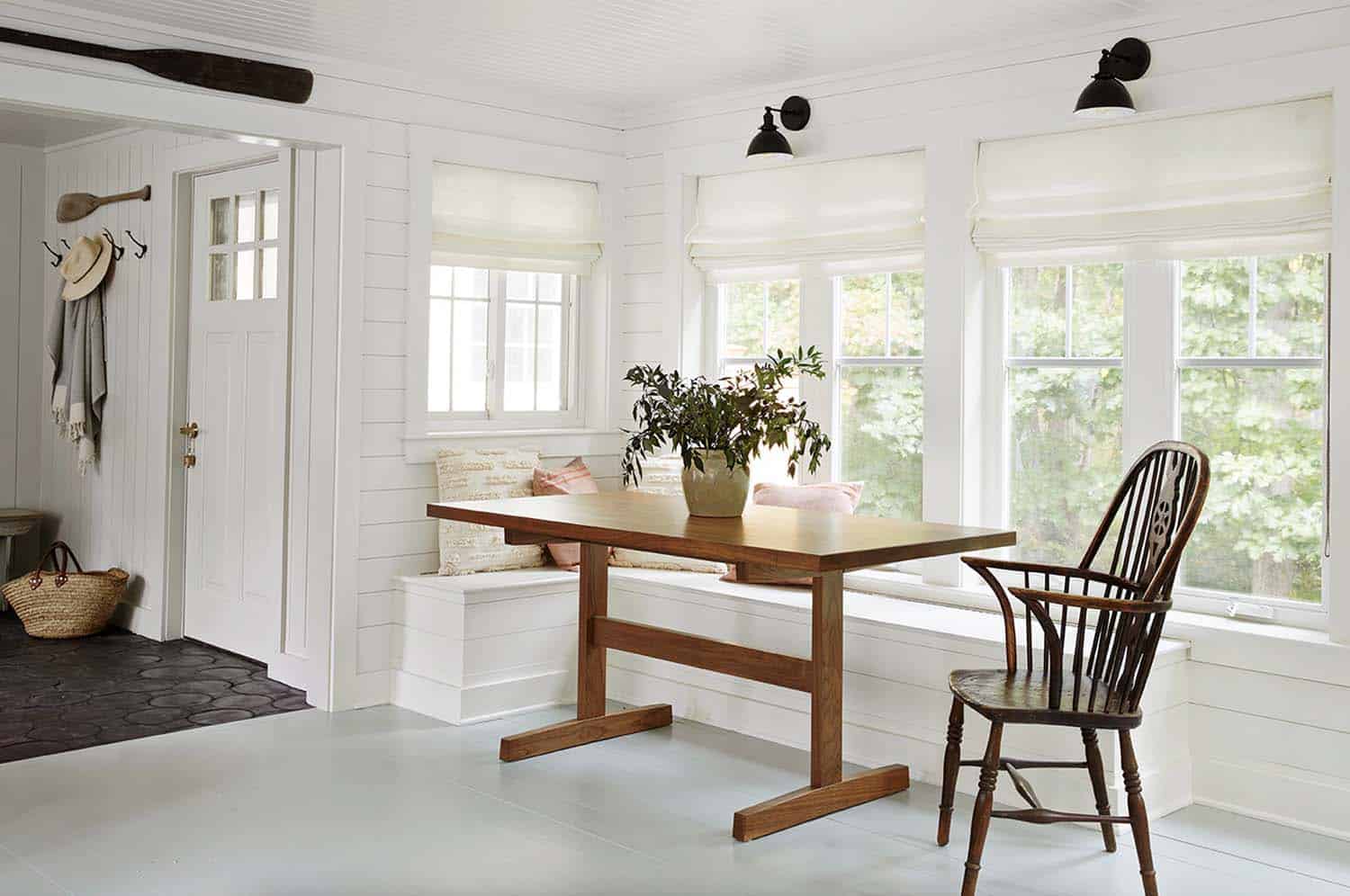 beach style home entry and breakfast banquette with a large window