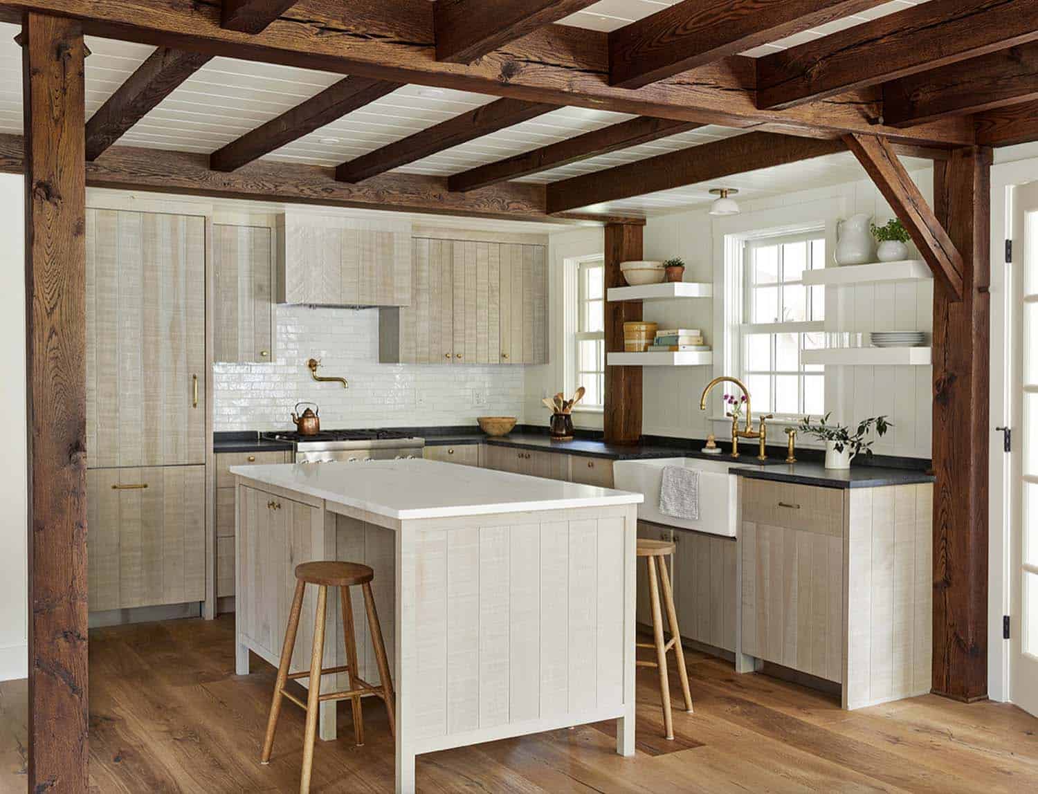 beach style kitchen with wood beams on the ceiling