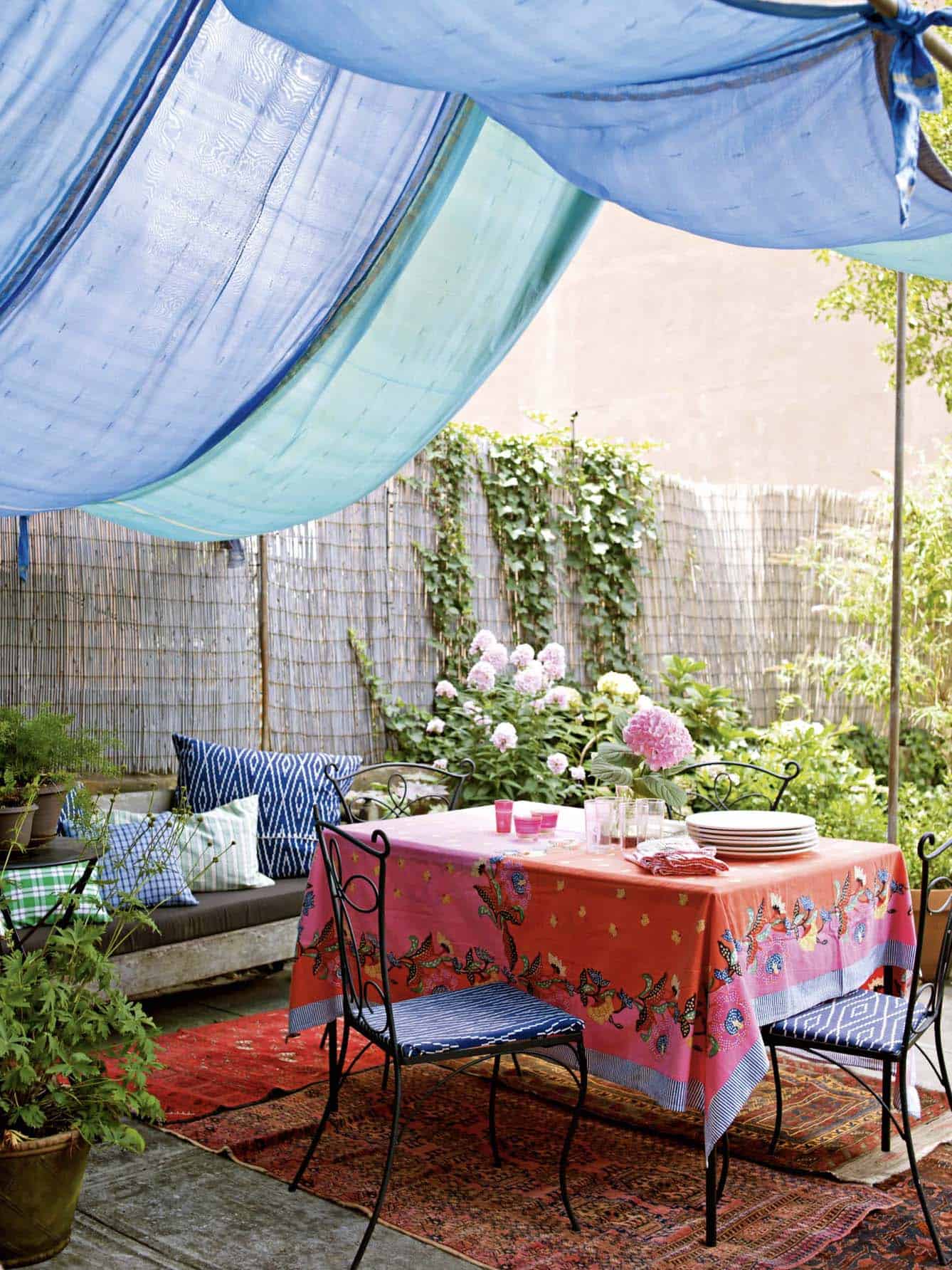 small-backyard-patio-with-a-bistro-set-and-shade-sail