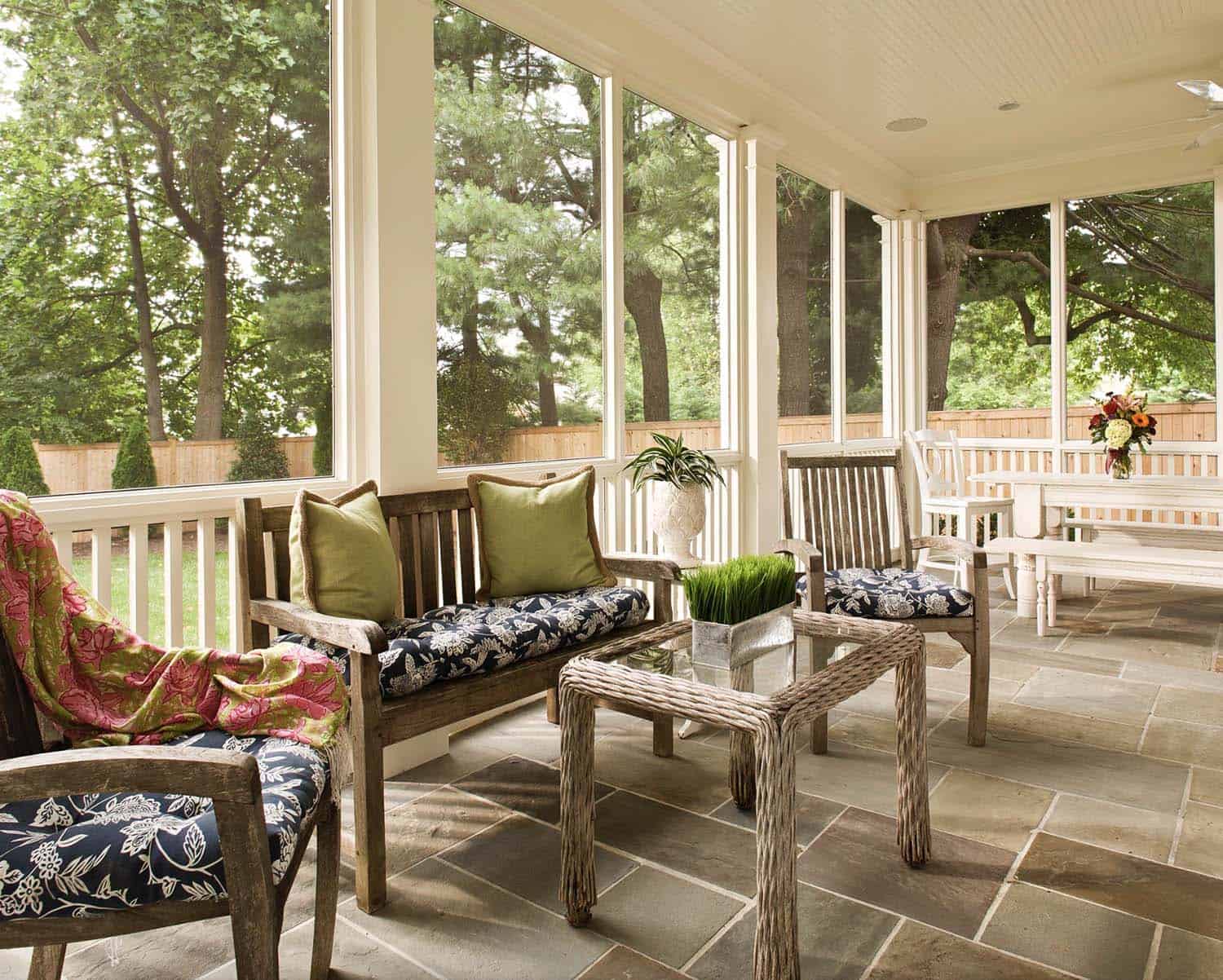 traditional style screen porch with flagstone flooring