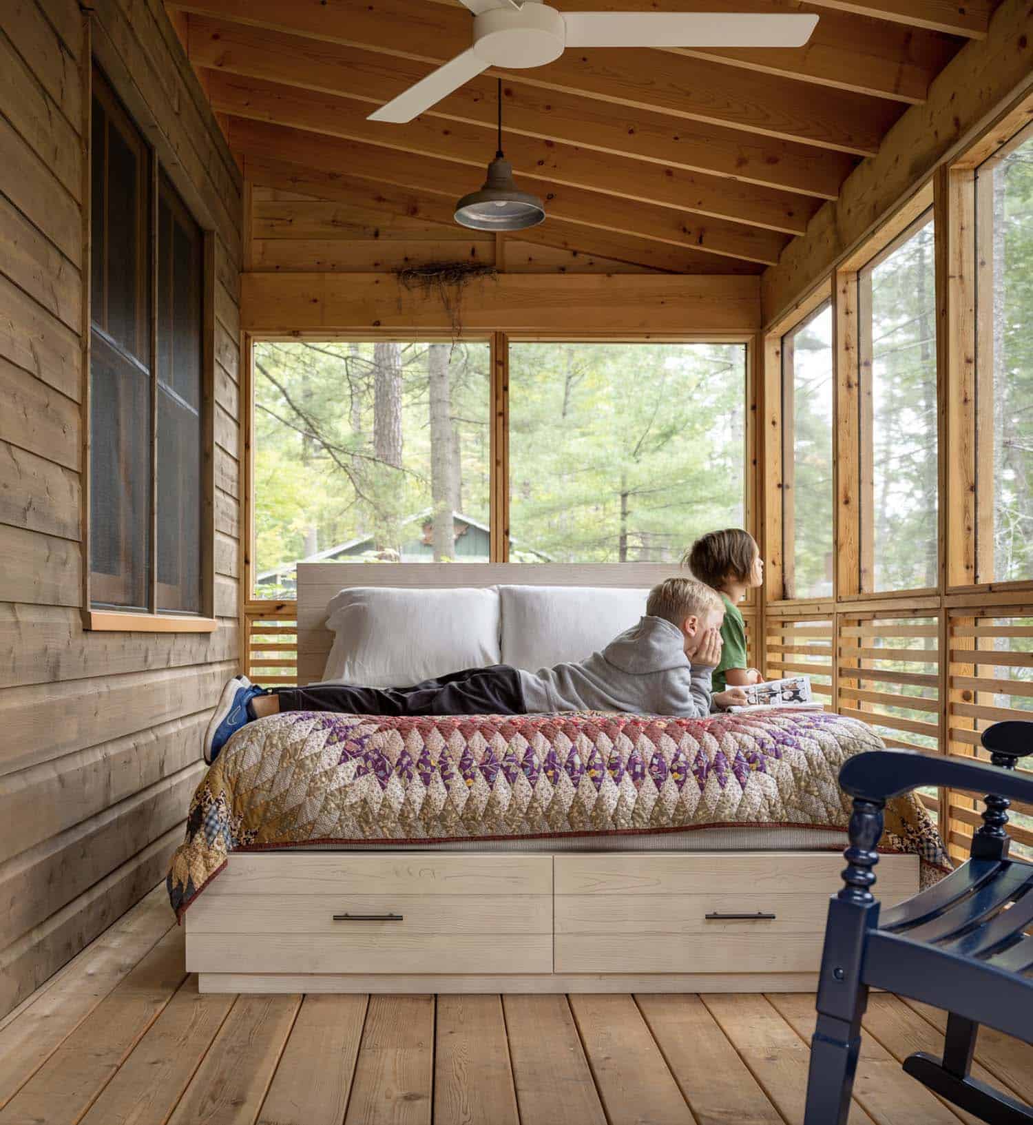 screened porch with a daybed