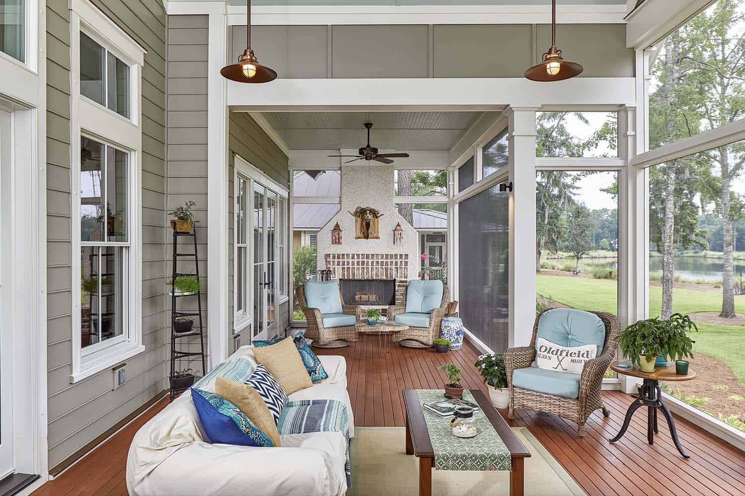 screened porch with rustic elegance and a focal point fireplace
