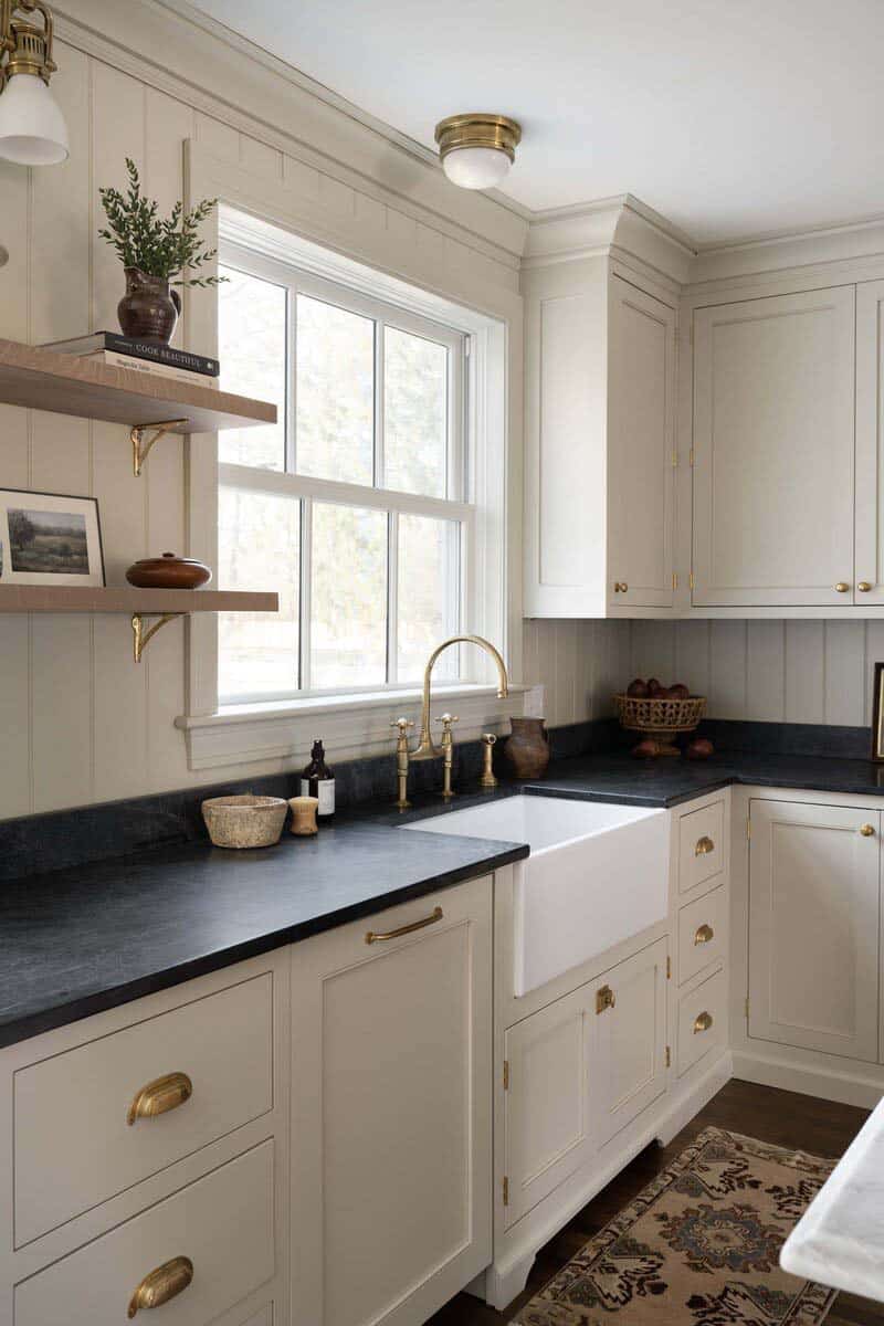 transitional kitchen with a soapstone backsplash and countertops