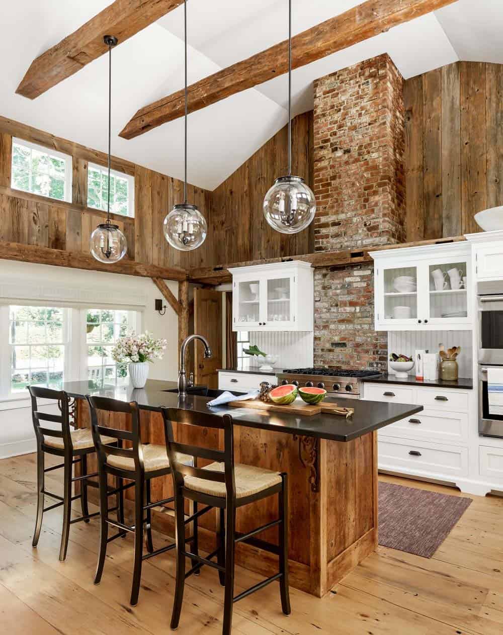 rustic modern kitchen with tall ceilings and wood beams