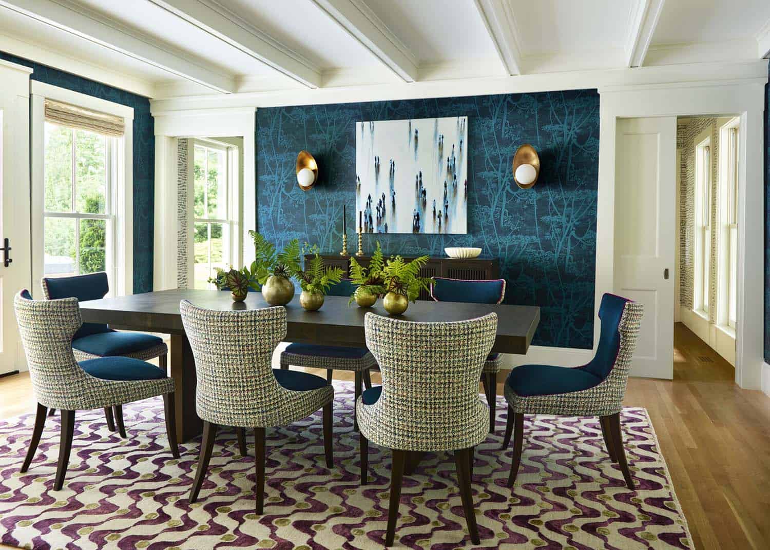 contemporary dining room with a blue accent wall