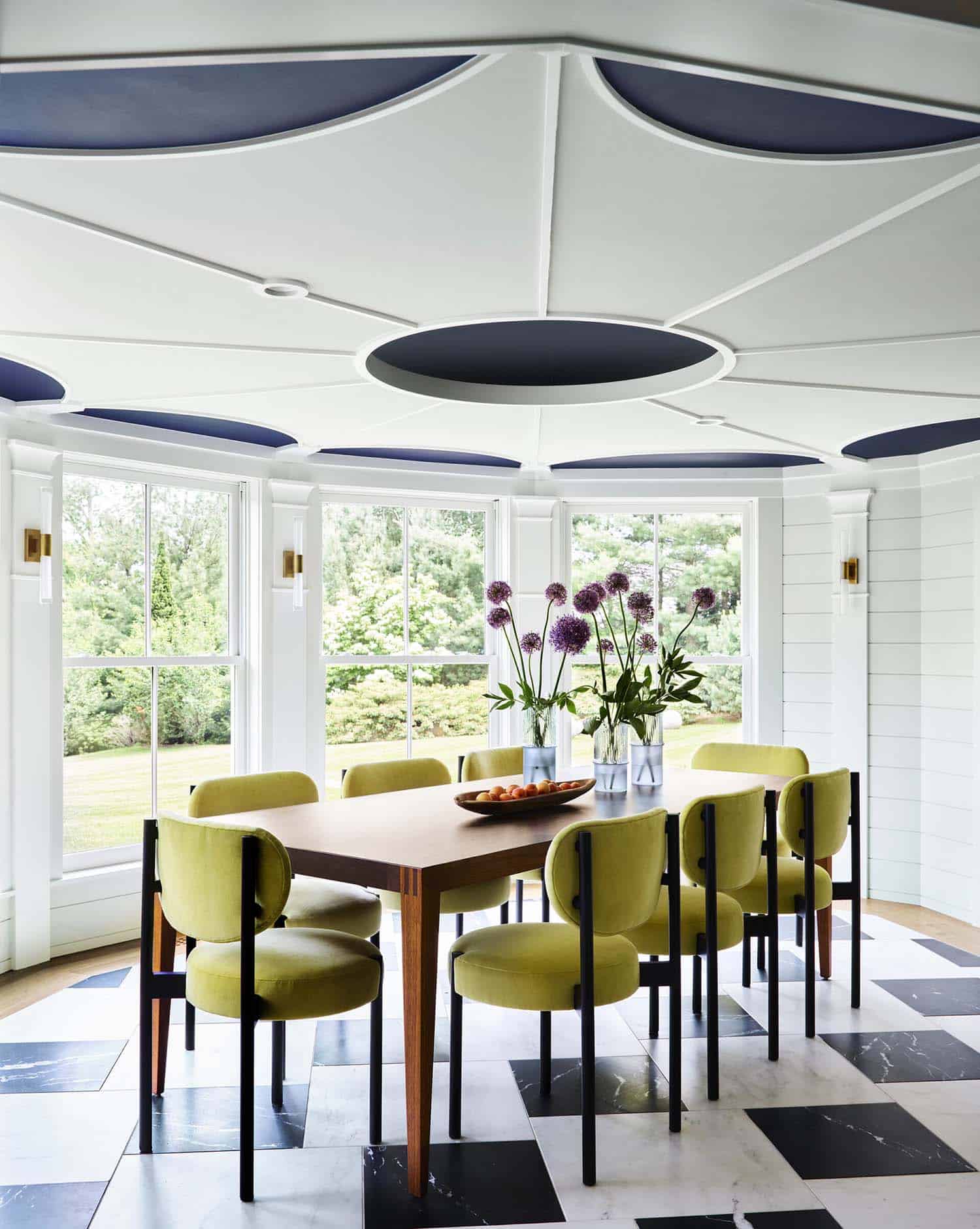 contemporary dining room with green chairs