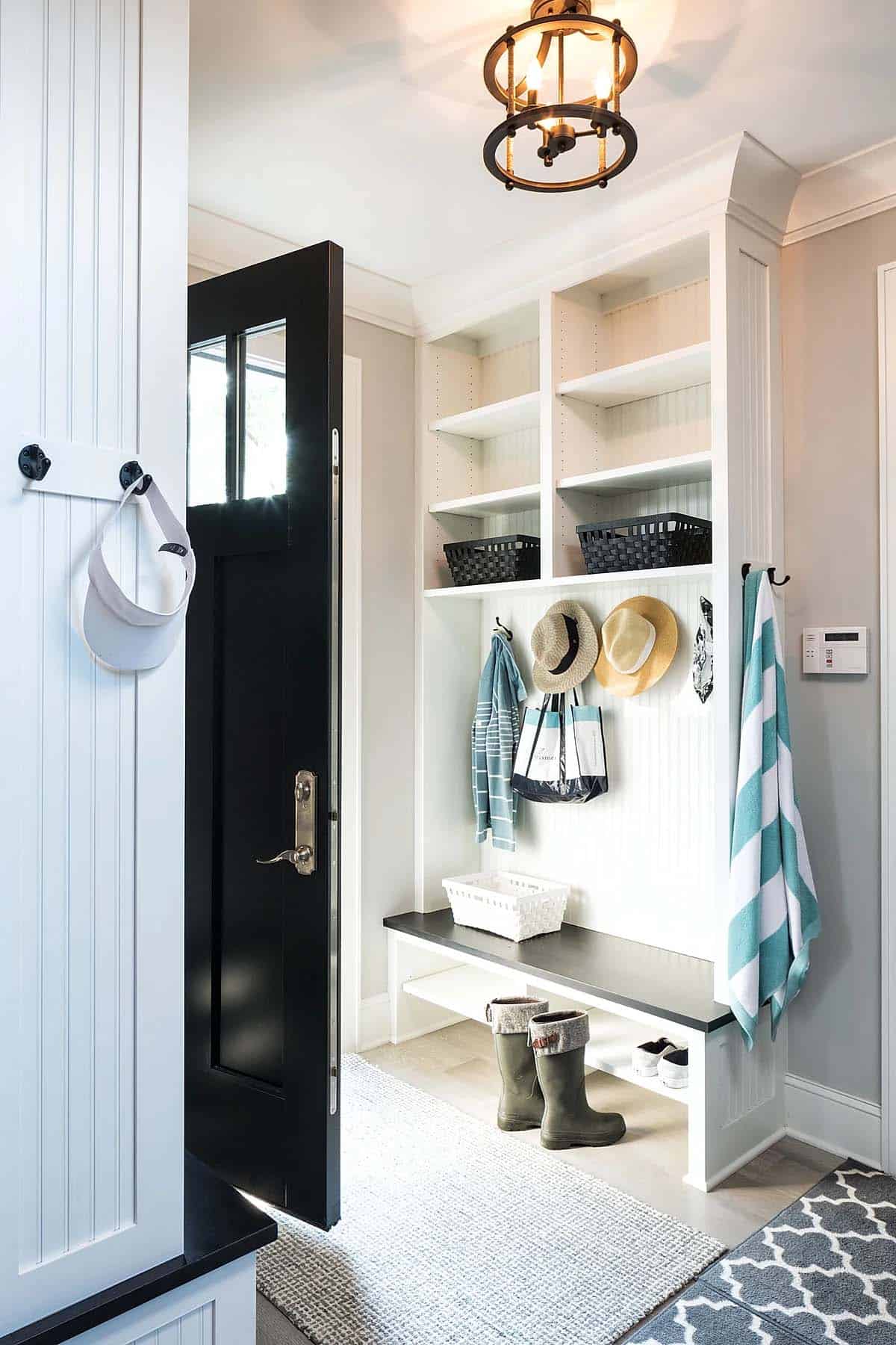 contemporary mudroom entry with a bench and storage