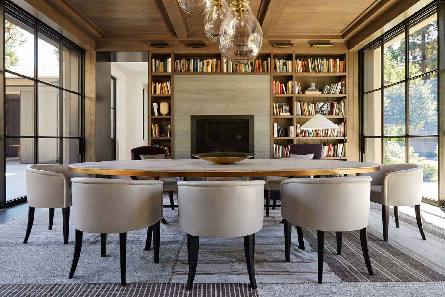 cool contemporary formal dining room with a library