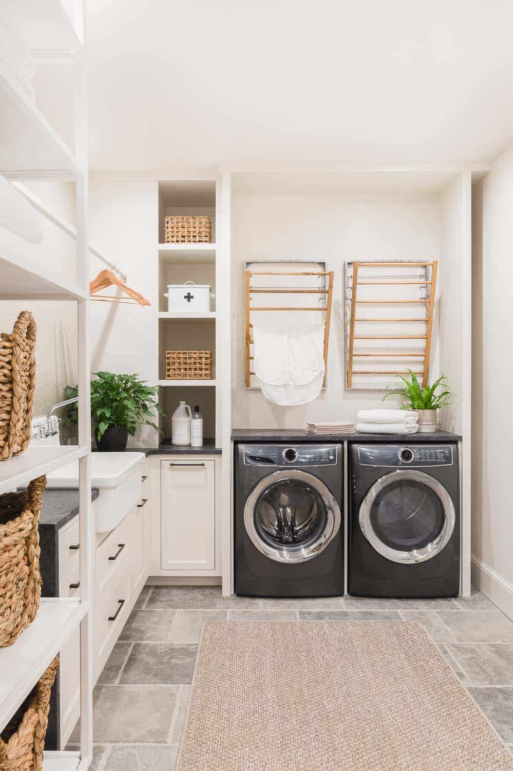 transitional style laundry room with drying racks