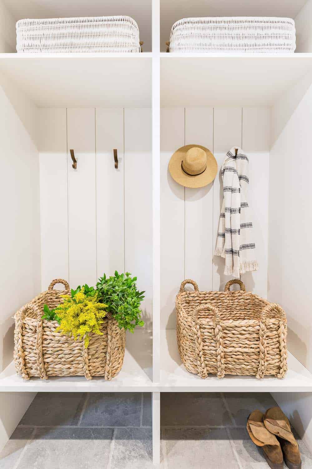 transitional style mudroom with wall hooks and storage
