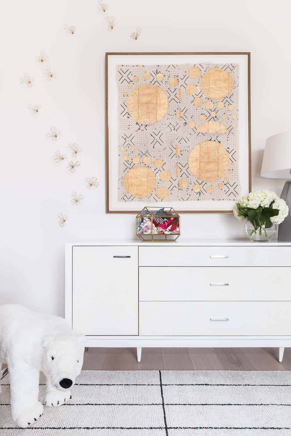 transitional style nursery with a dresser