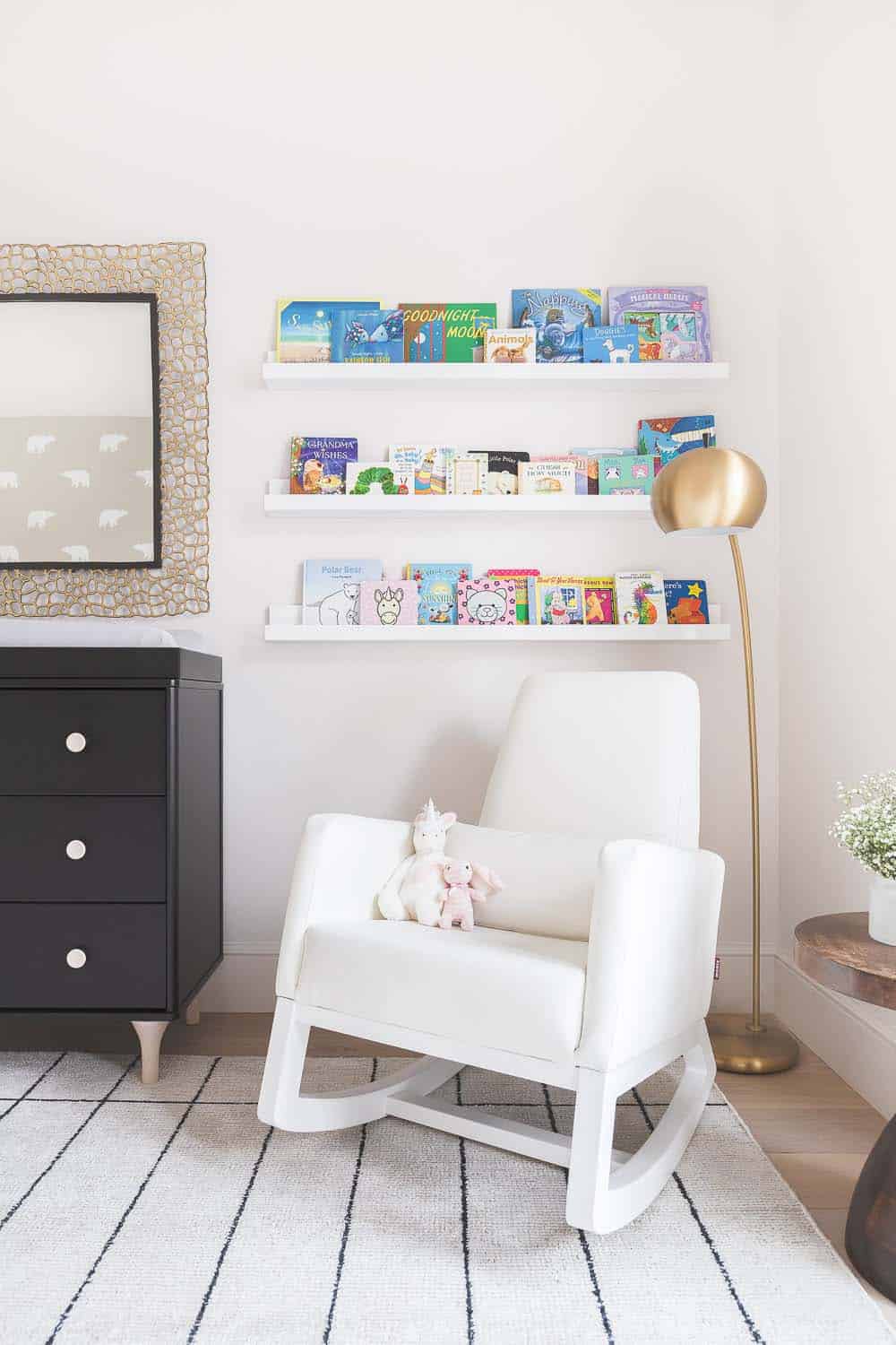 transitional style nursery with a reading nook