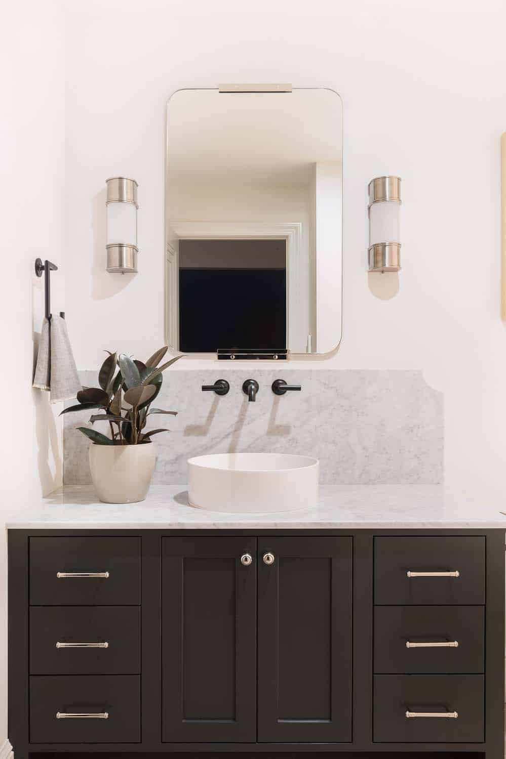 transitional style bathroom with a dark vanity