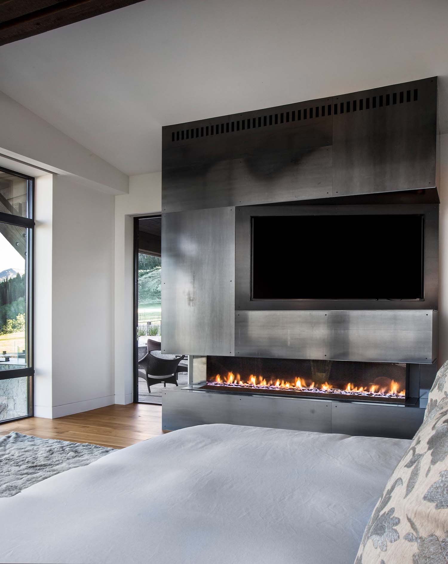 modern bedroom with a fireplace