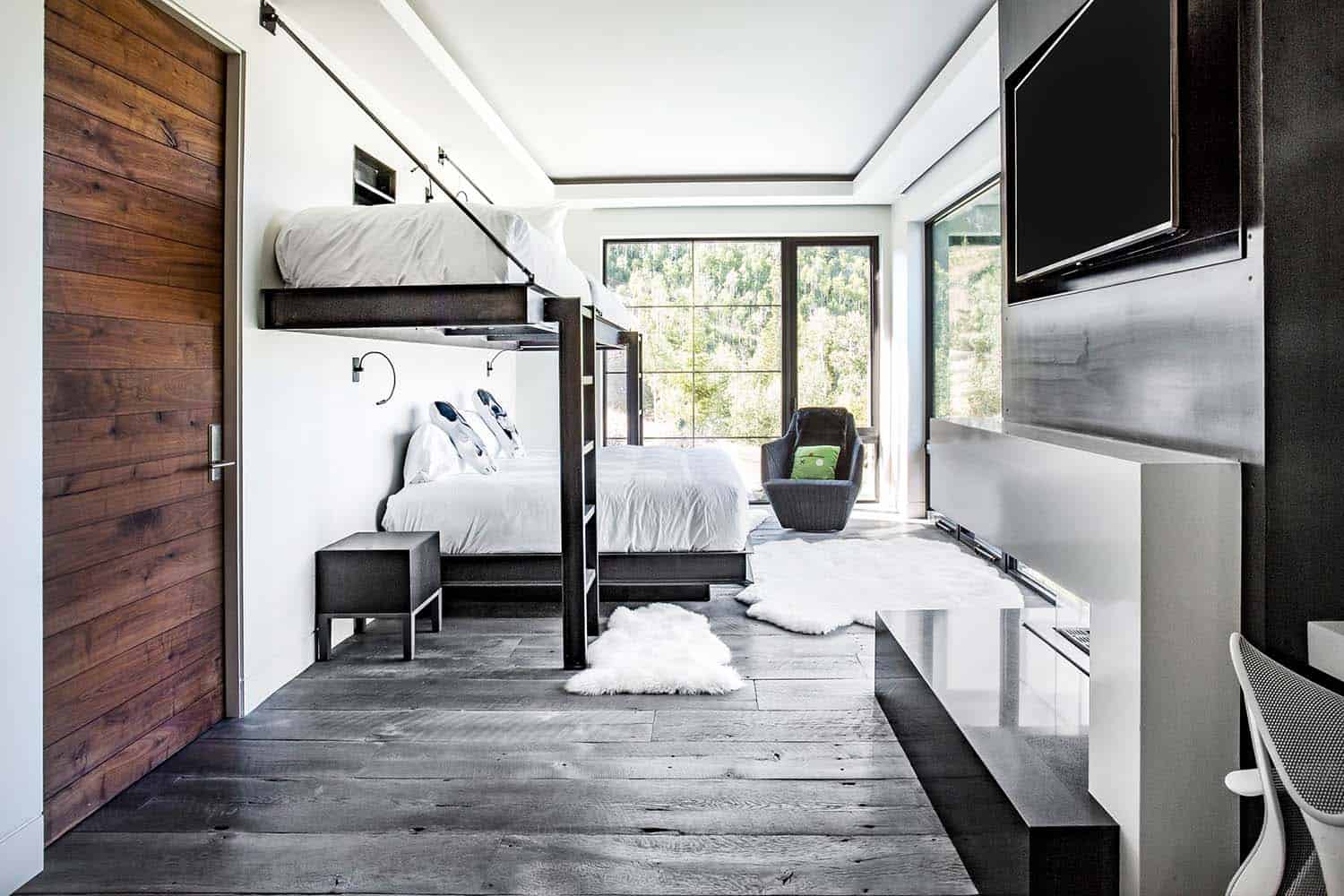 modern bunk bedroom with a large window