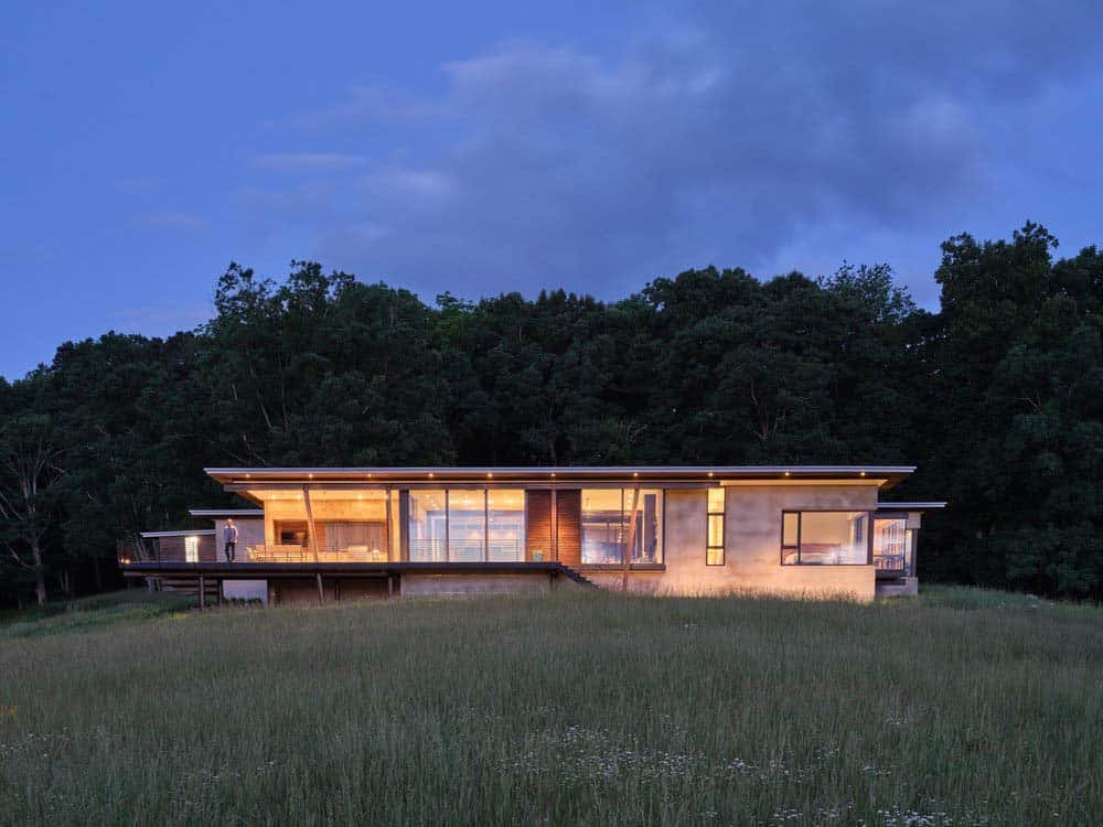 modern meadow house exterior at dusk