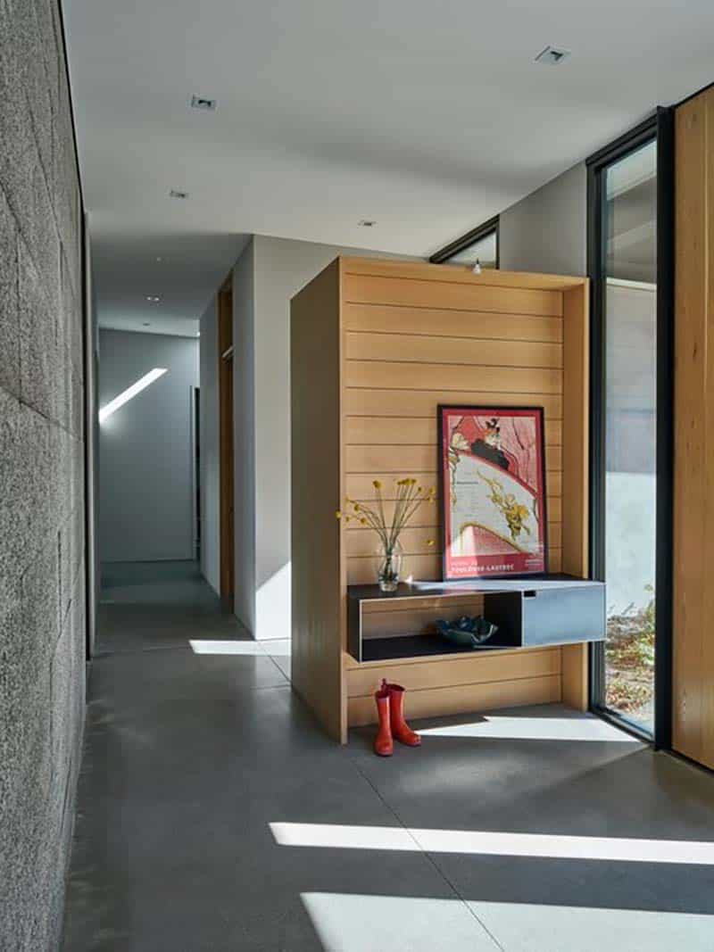 modern meadow house entry with a floating entry table