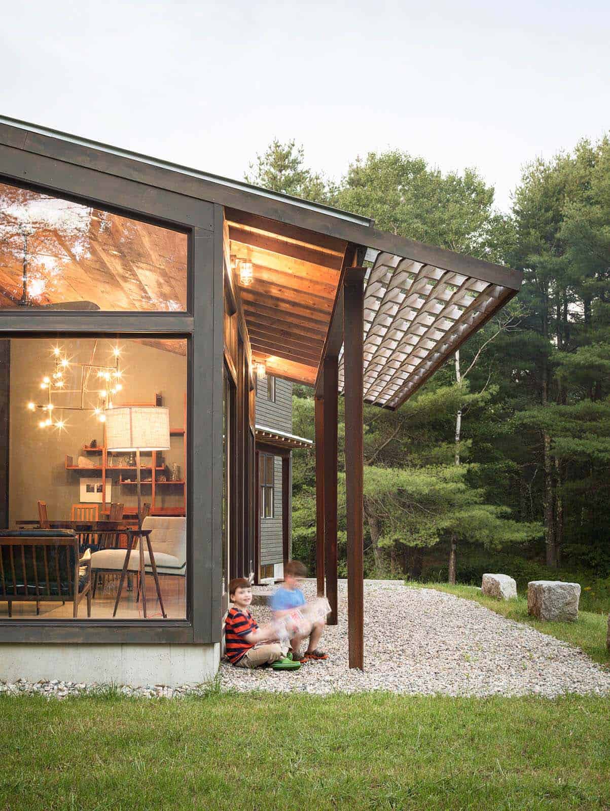 modern barn home exterior with a patio