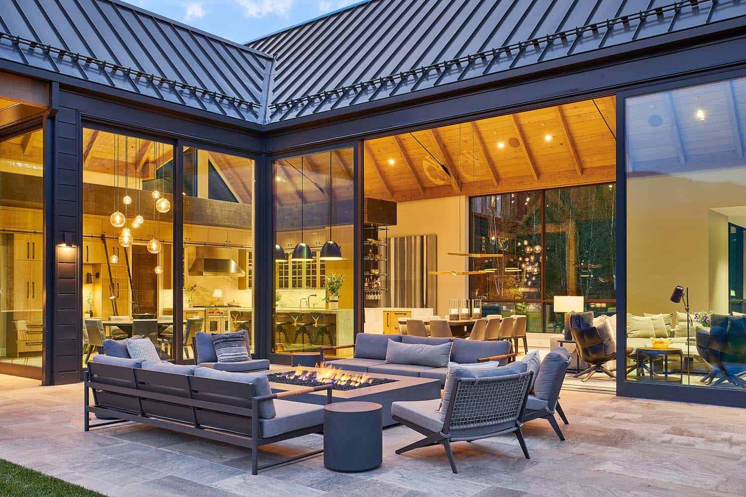modern-farmhouse-home-exterior-patio-at-dusk
