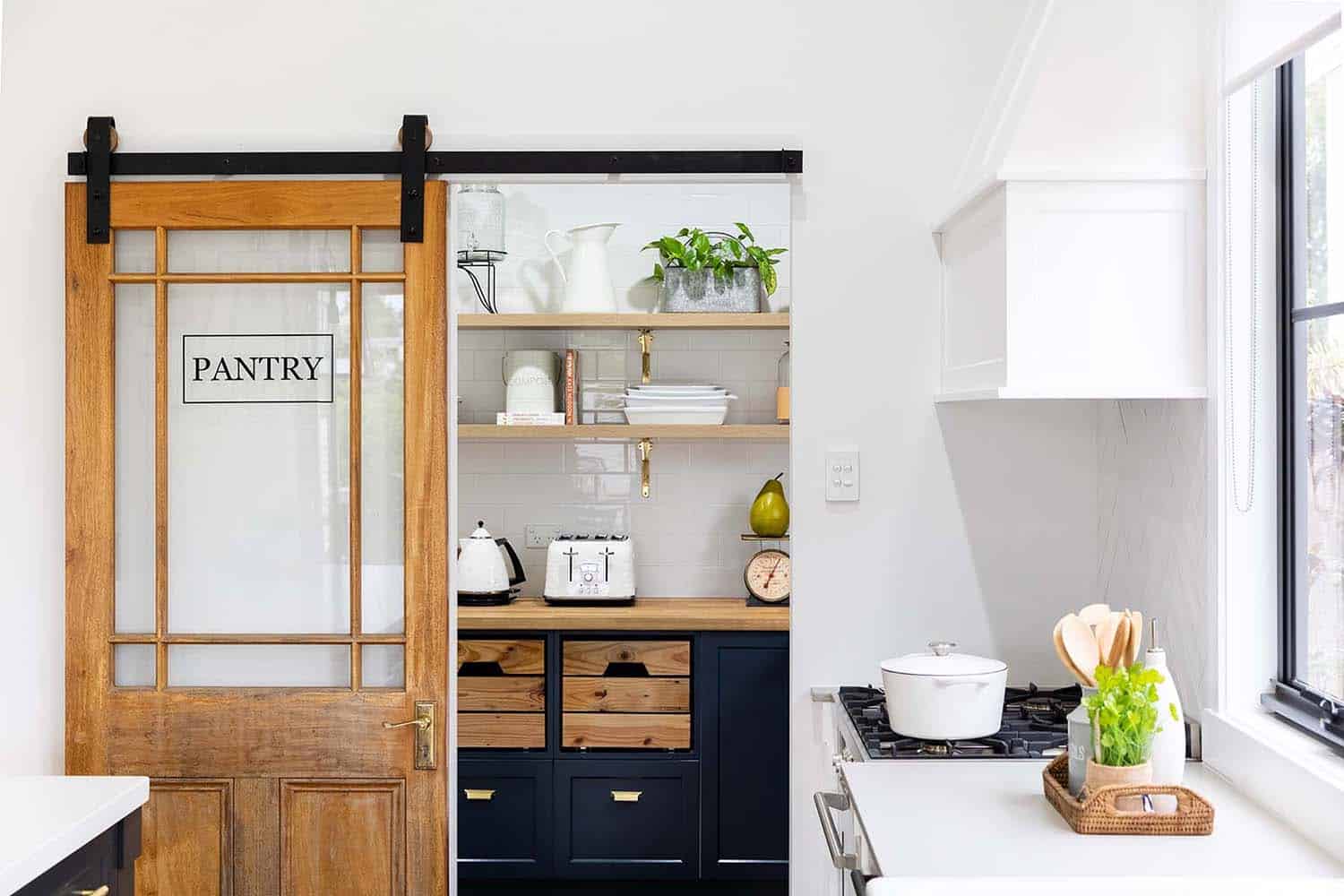 modern-farmhouse-kitchen-pantry-with-a-sliding-barn-door