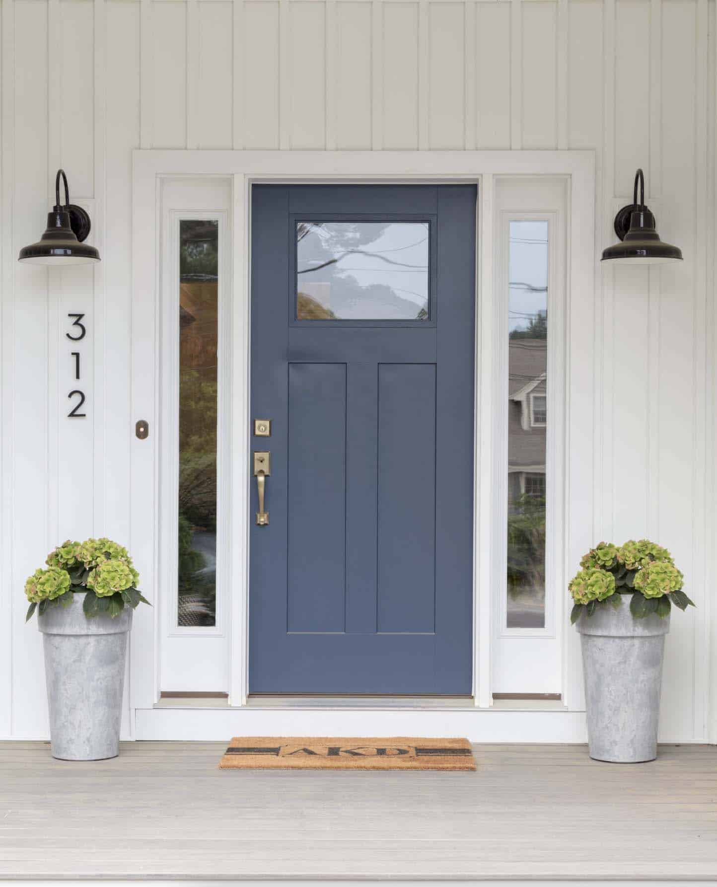 farmhouse exterior entry with a blue door