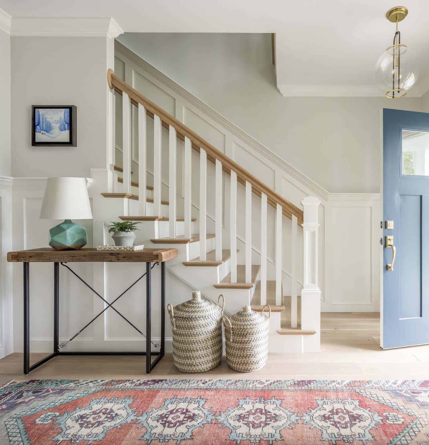 farmhouse entry with a staircase and vintage runner