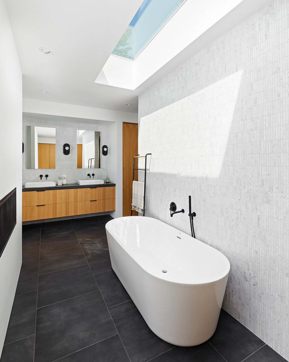 modern-bathroom-with-a-freestanding-tub-and-skylight