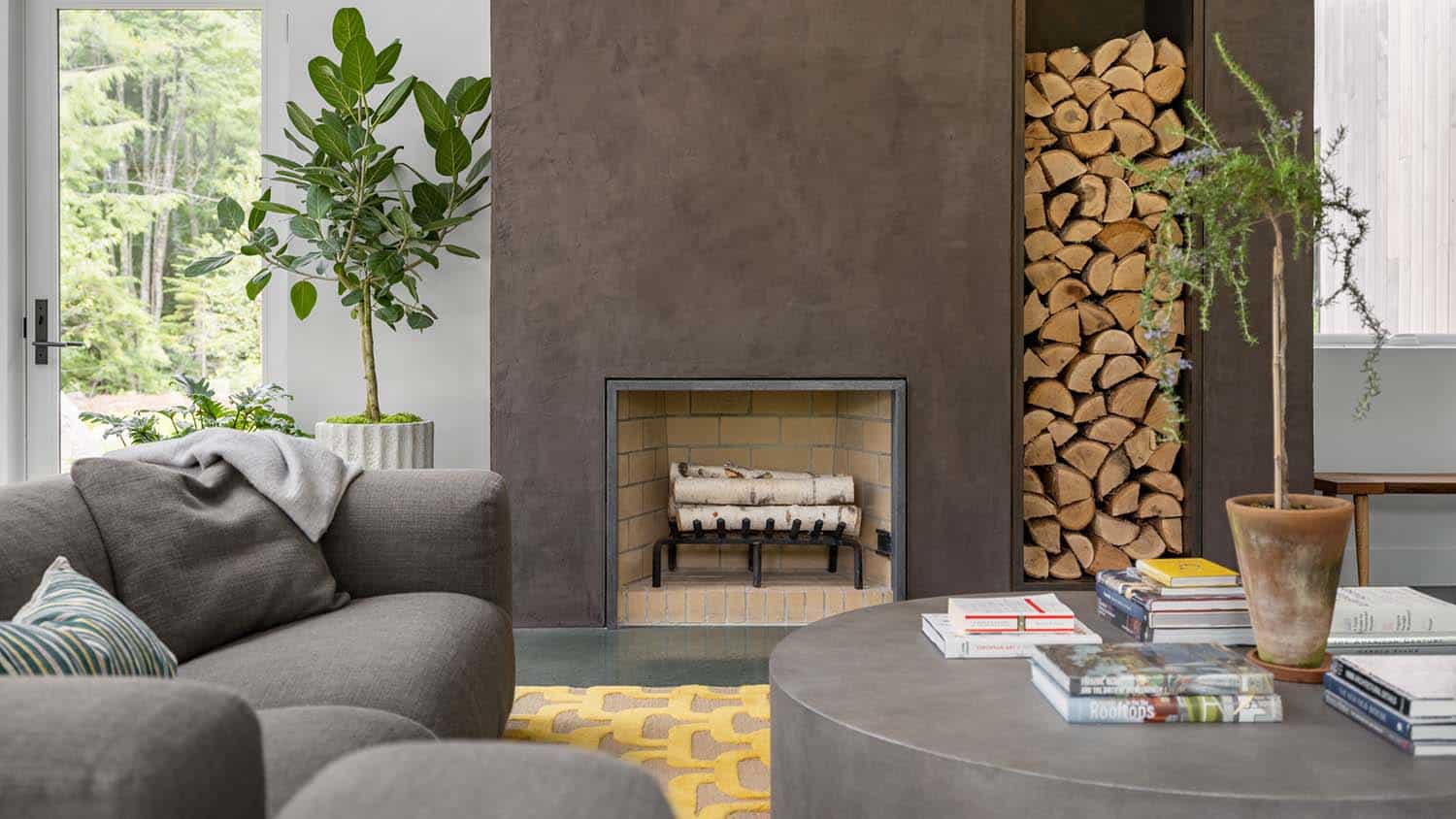modern living room with a fireplace and wood storage