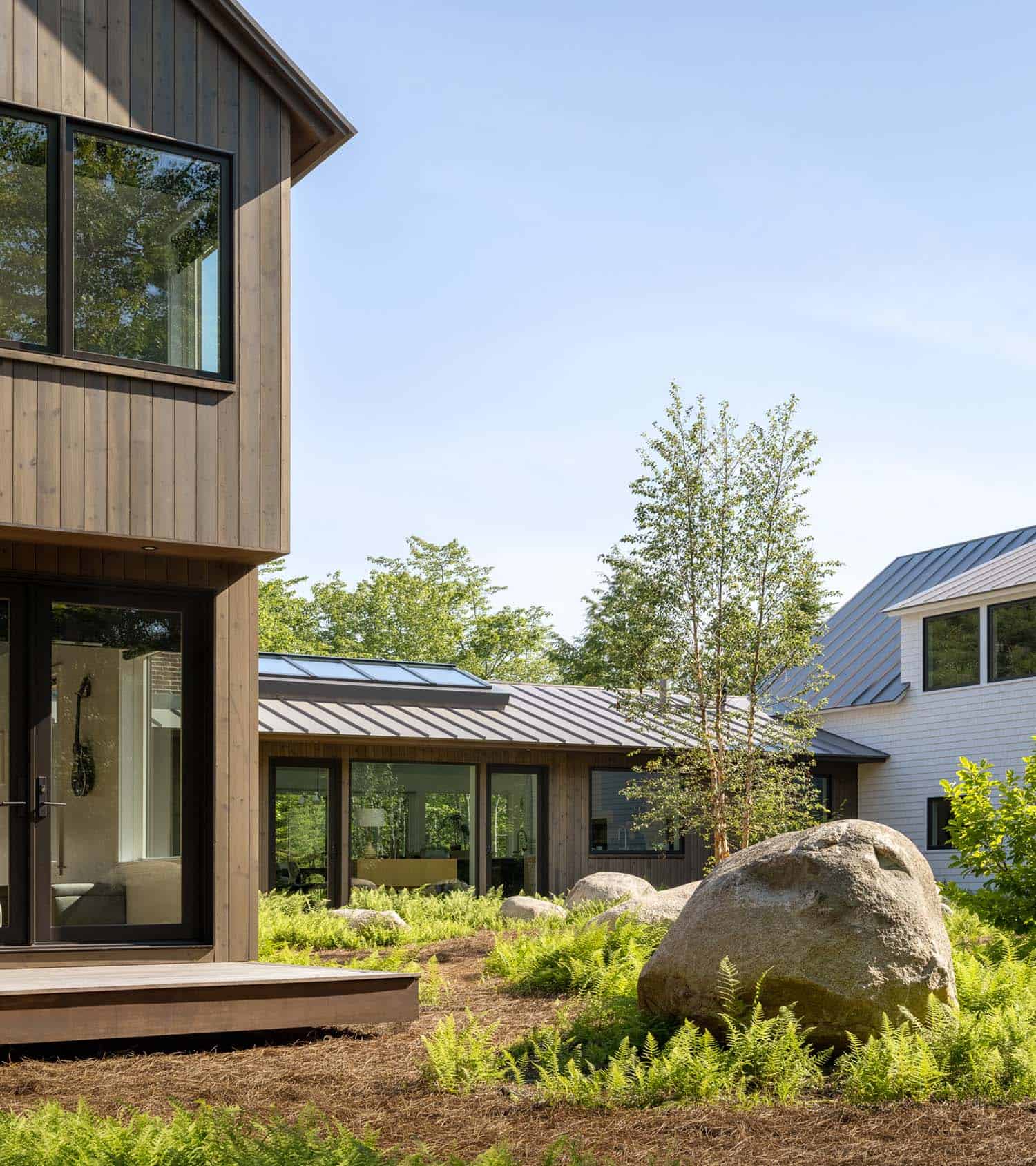 modern sustainable home exterior with native plantings