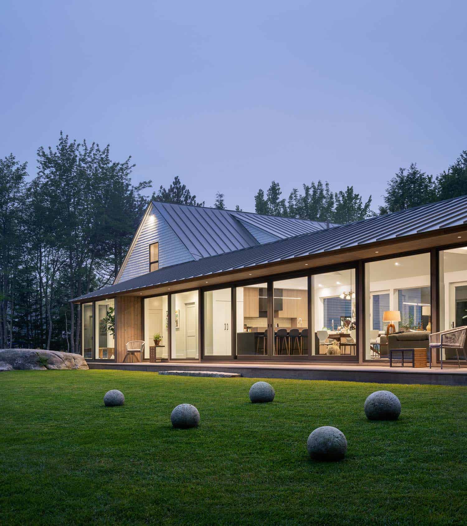 modern sustainable home exterior at dusk