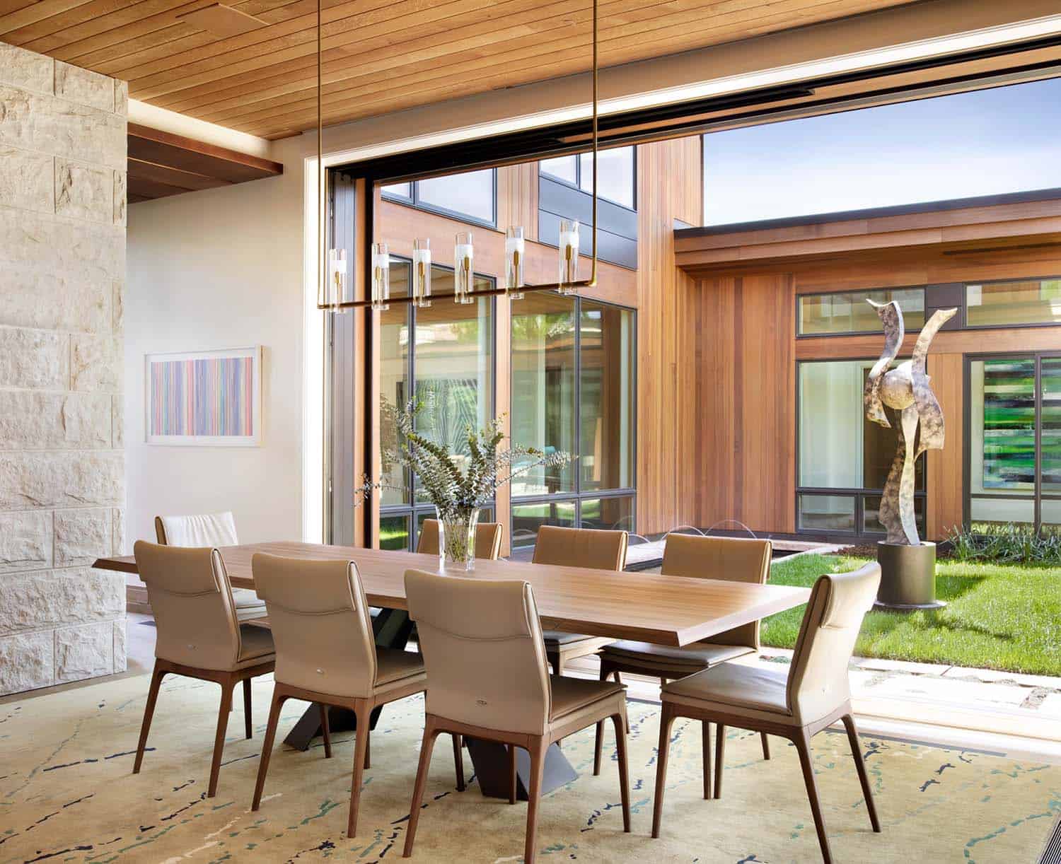 modern dining room with a view to a central courtyard