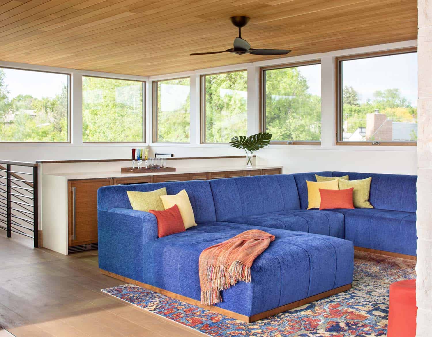 modern family room with a blue sectional sofa