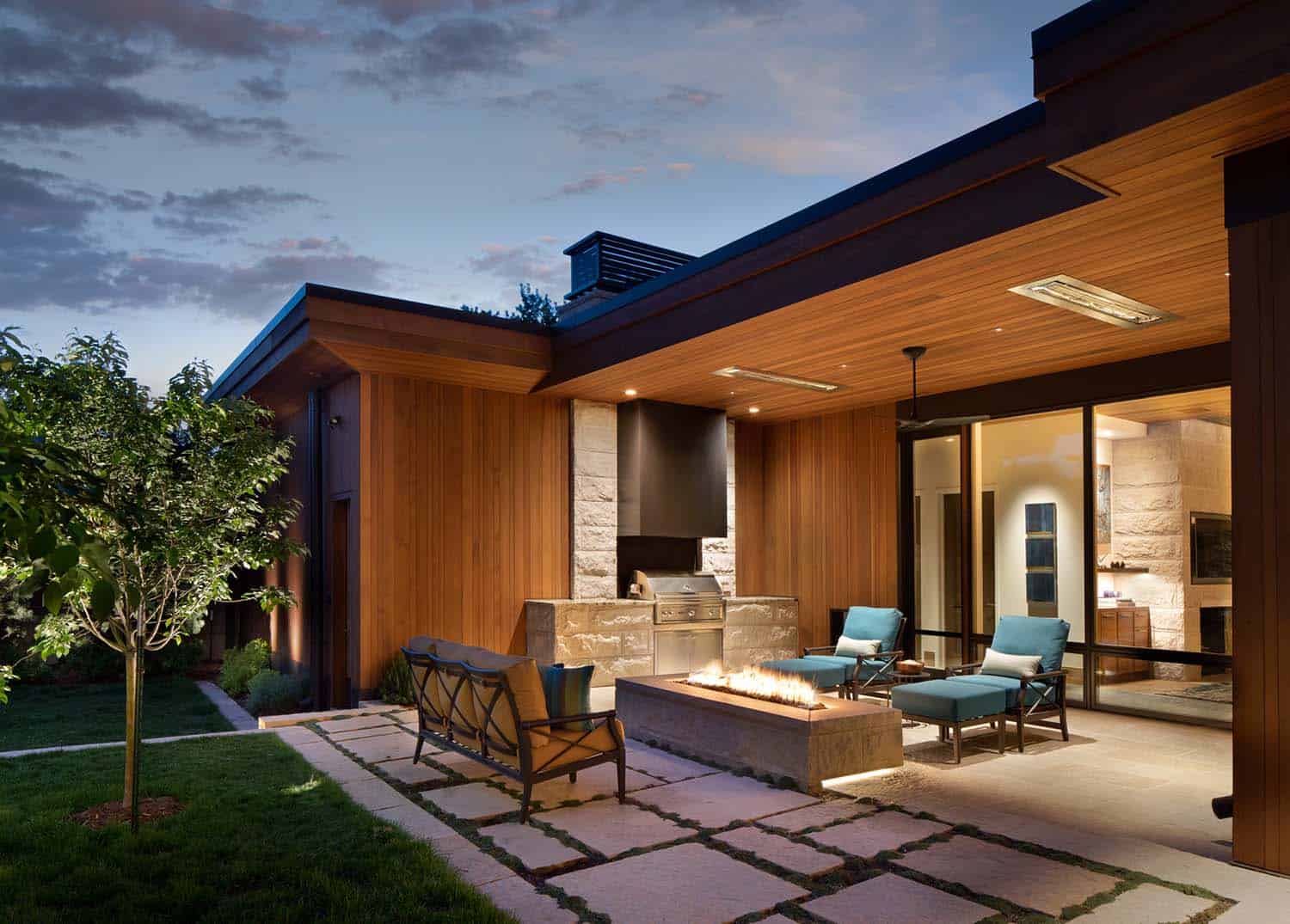 modern urban house exterior patio with a fire pit