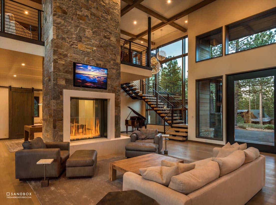 mountain contemporary living room with a fireplace
