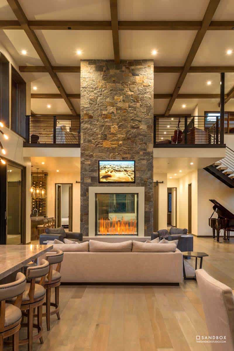 mountain contemporary living room with a fireplace