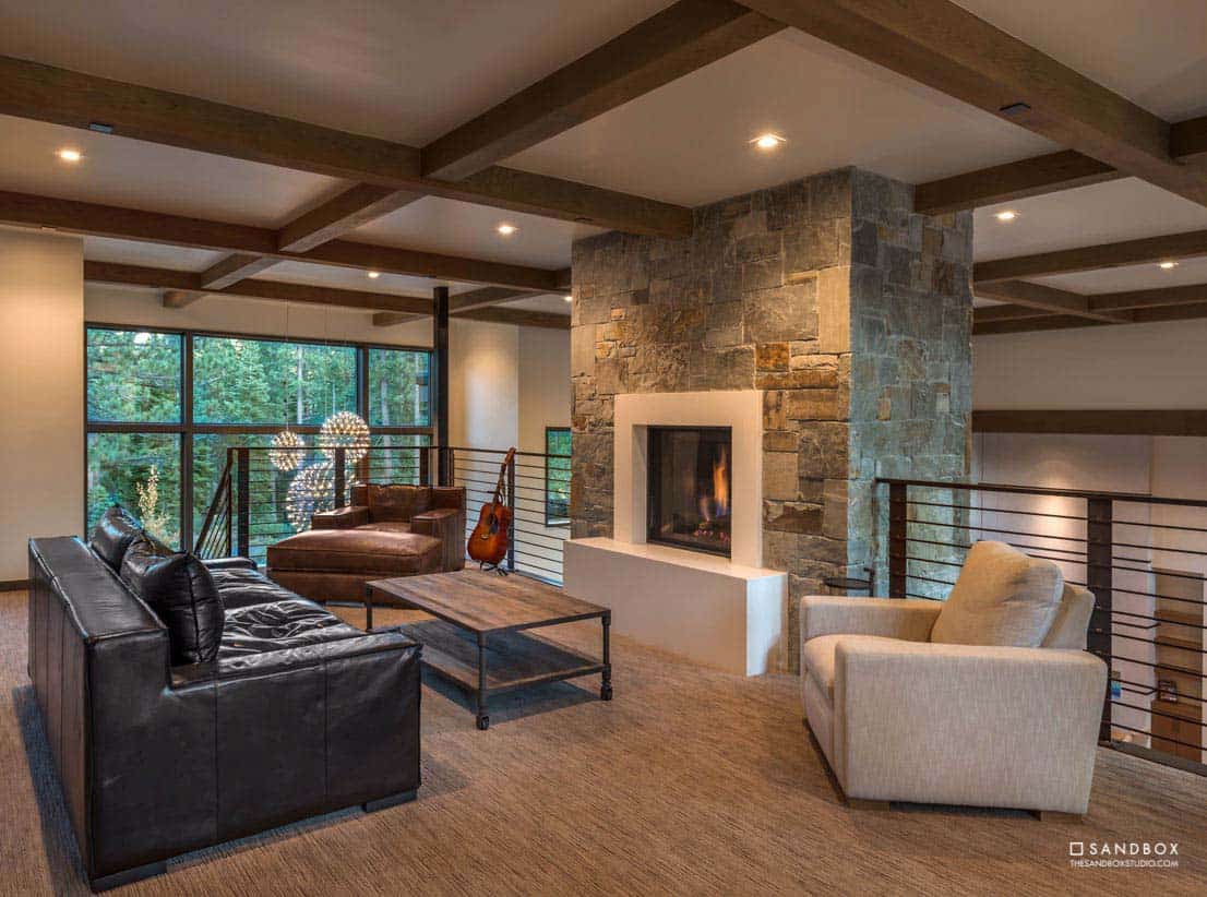 mountain contemporary family room with a fireplace